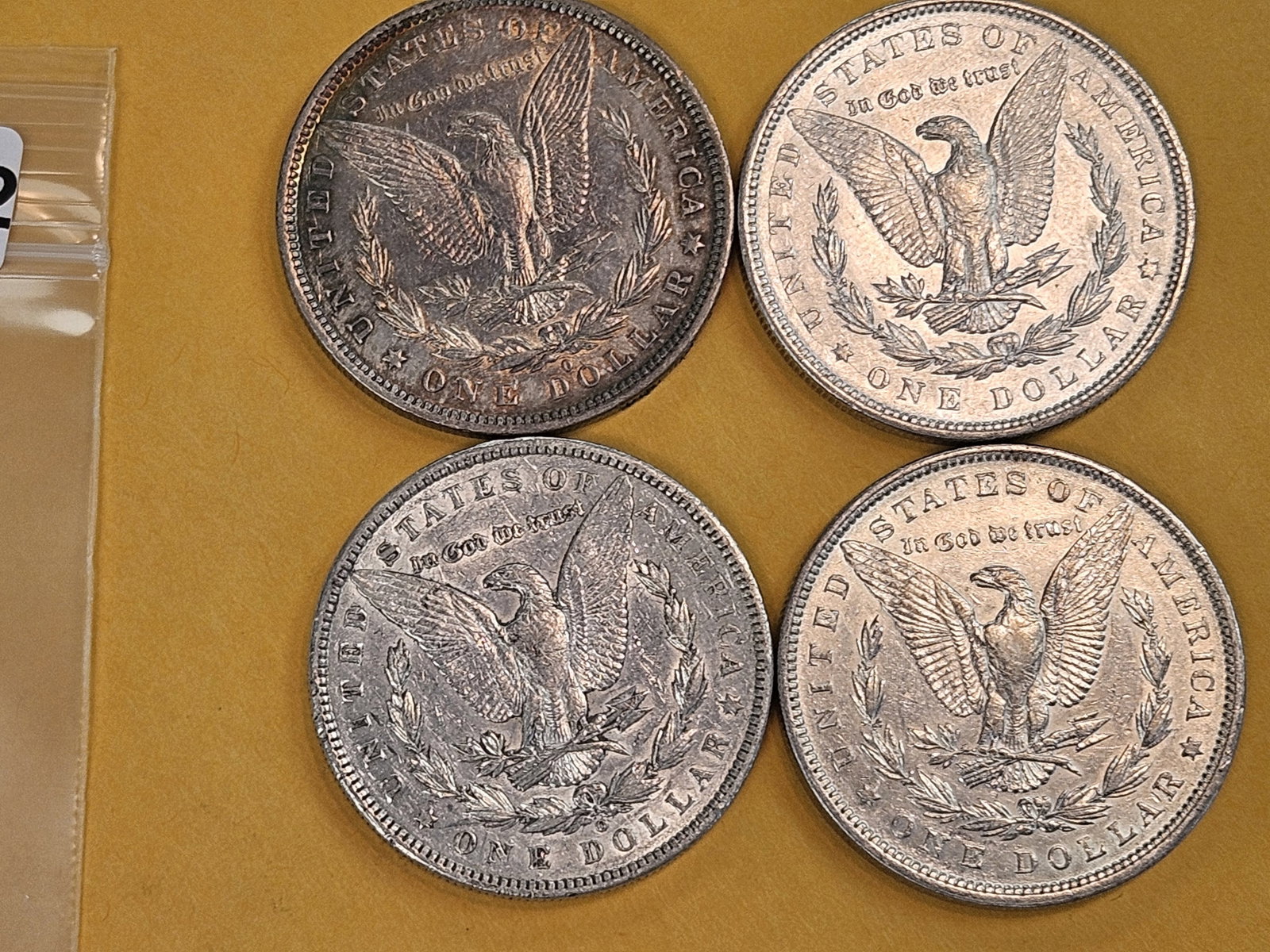 Four mixed Morgan Silver Dollars - 3
