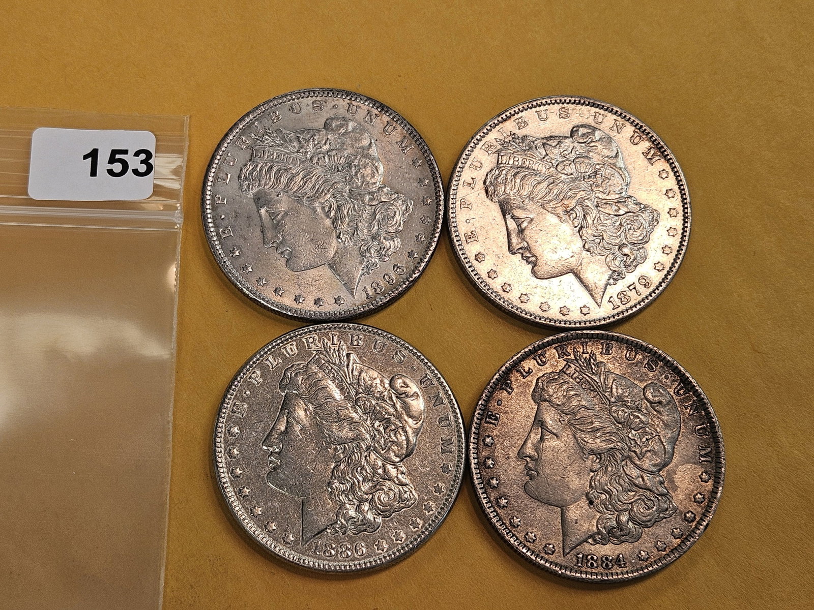 Four mixed Morgan Silver Dollars - 2
