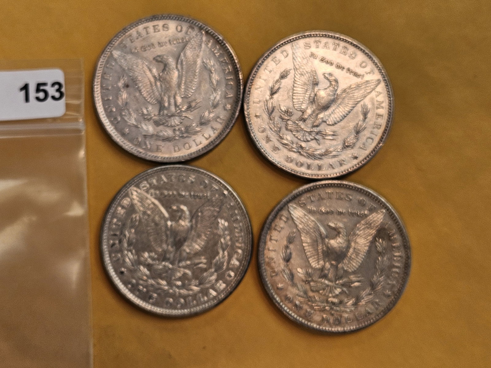 Four mixed Morgan Silver Dollars - 3