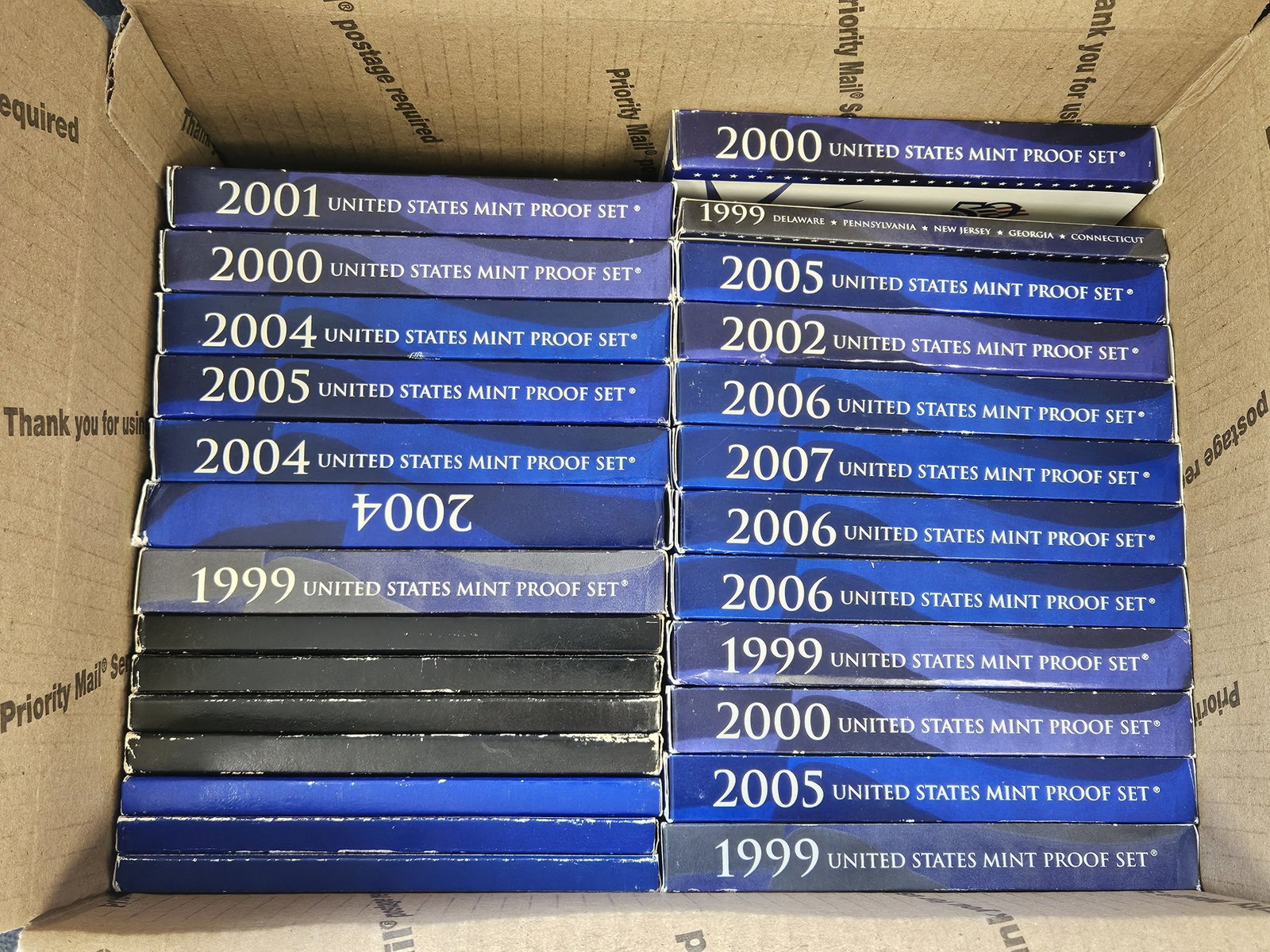 Twenty-six US Proof Sets: Ships separately in a Flat Rate Medium Box. Some Duplicates. Mixed. No Combined shipping