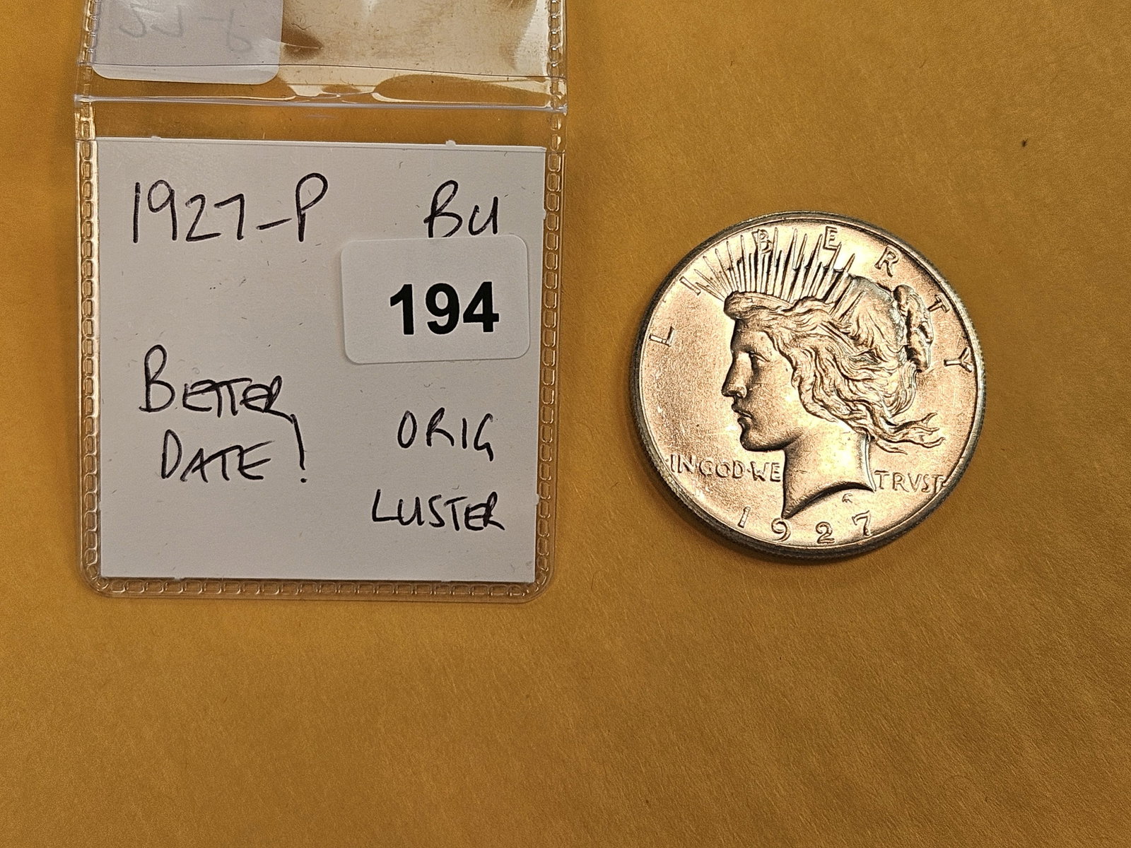 Better Grade 1927 Peace Silver Dollar in Choice Brilliant Uncirculated - 2