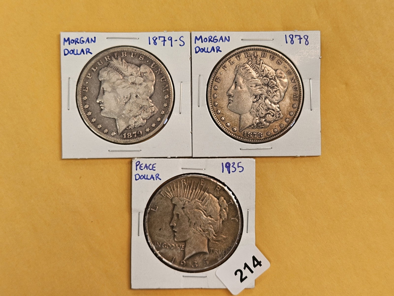 Three mixed Silver Dollars: Morgan and Peace