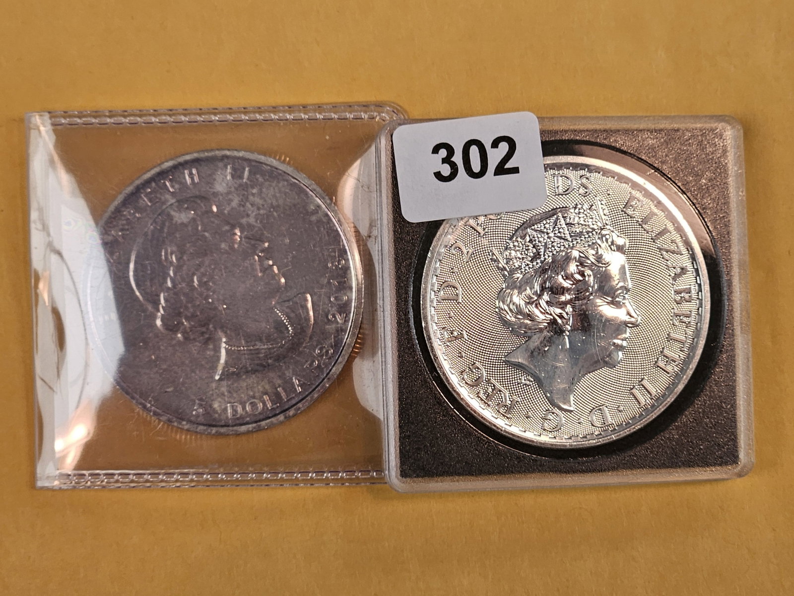 Two 1-troy ounce .999 fine silver World coins (1 of 2)