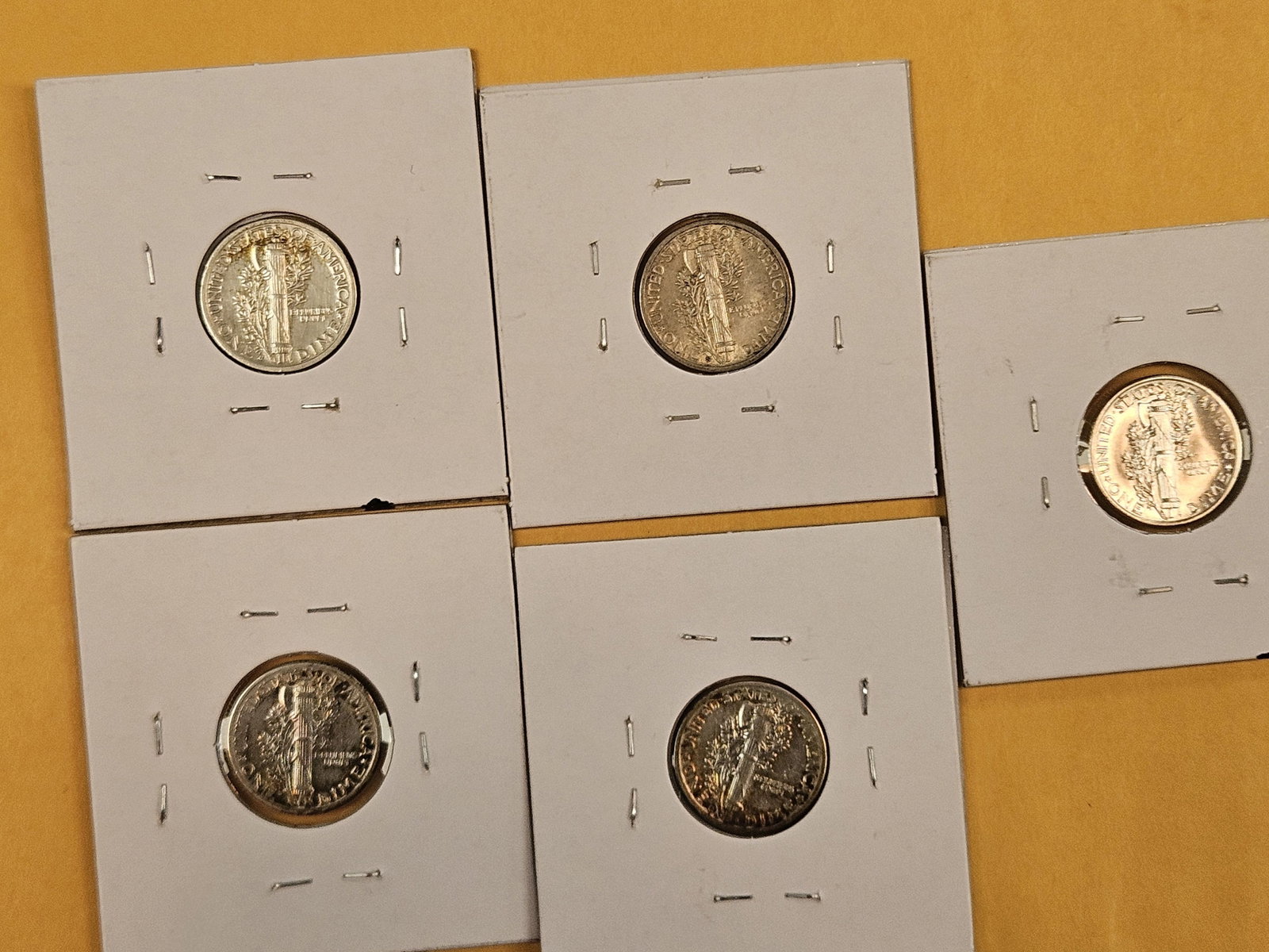 Five mixed silver Mercury Dimes - 5