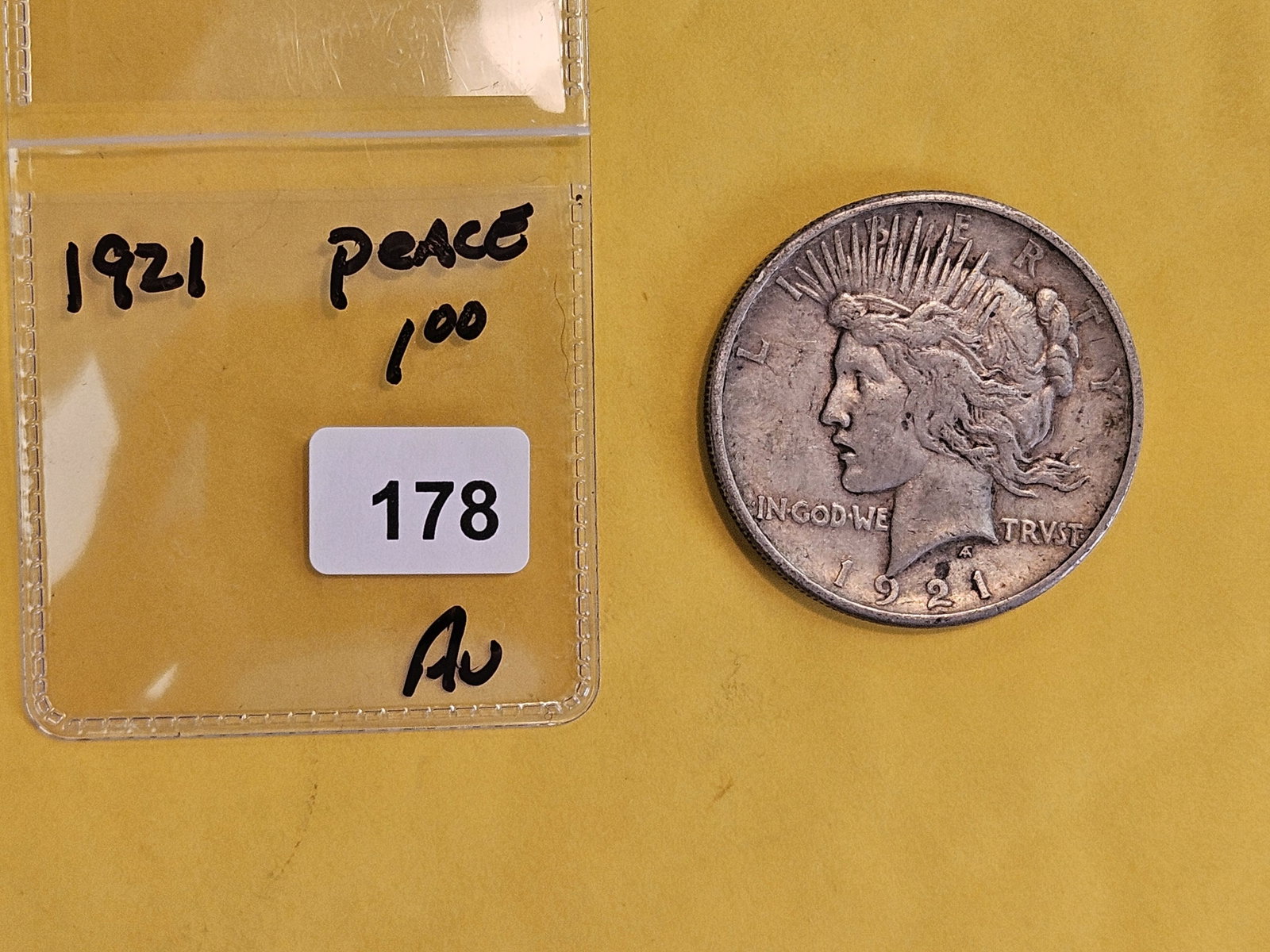 ** KEY DATE ** 1921 Peace Silver Dollar in About Uncirculated - 2