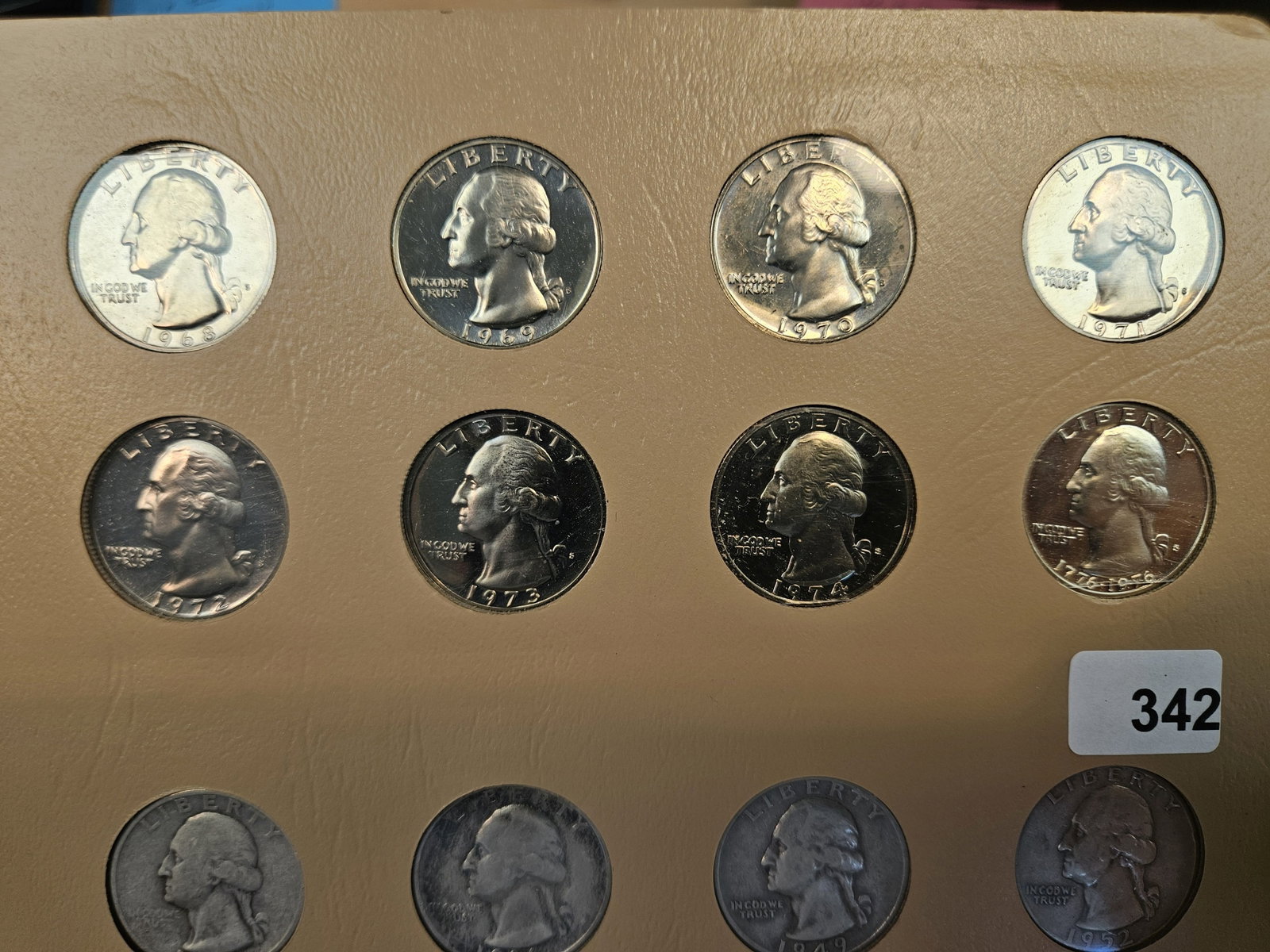 Page from a Dansco album with 24 Washington Quarters - 2