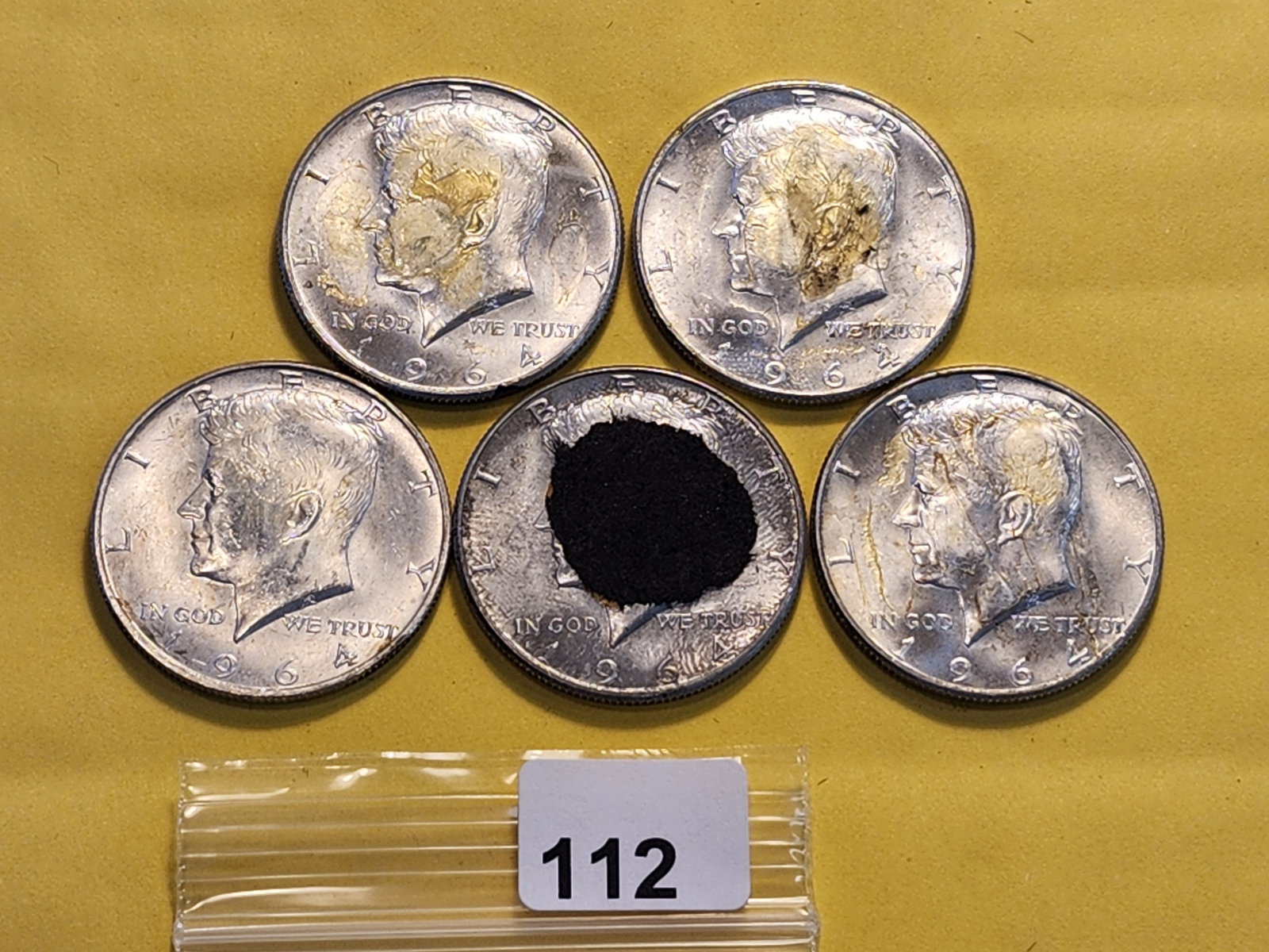 Five Kennedy Silver Half Dollars: All 1964. Has glue residue and paper