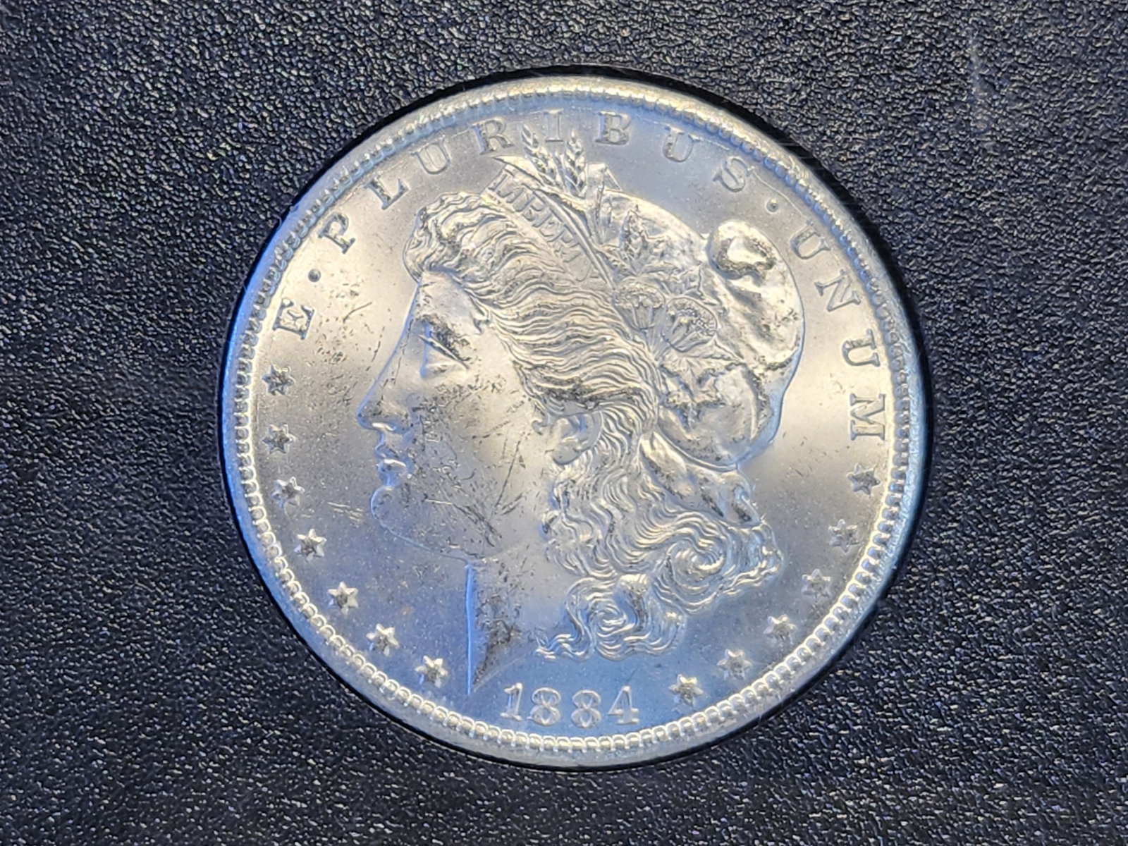 KEY DATE! 1884-CC Morgan Silver Dollar in Brilliant Uncirculated: Key Date! Carson City! In original GSA hard pack. No outer box or COA