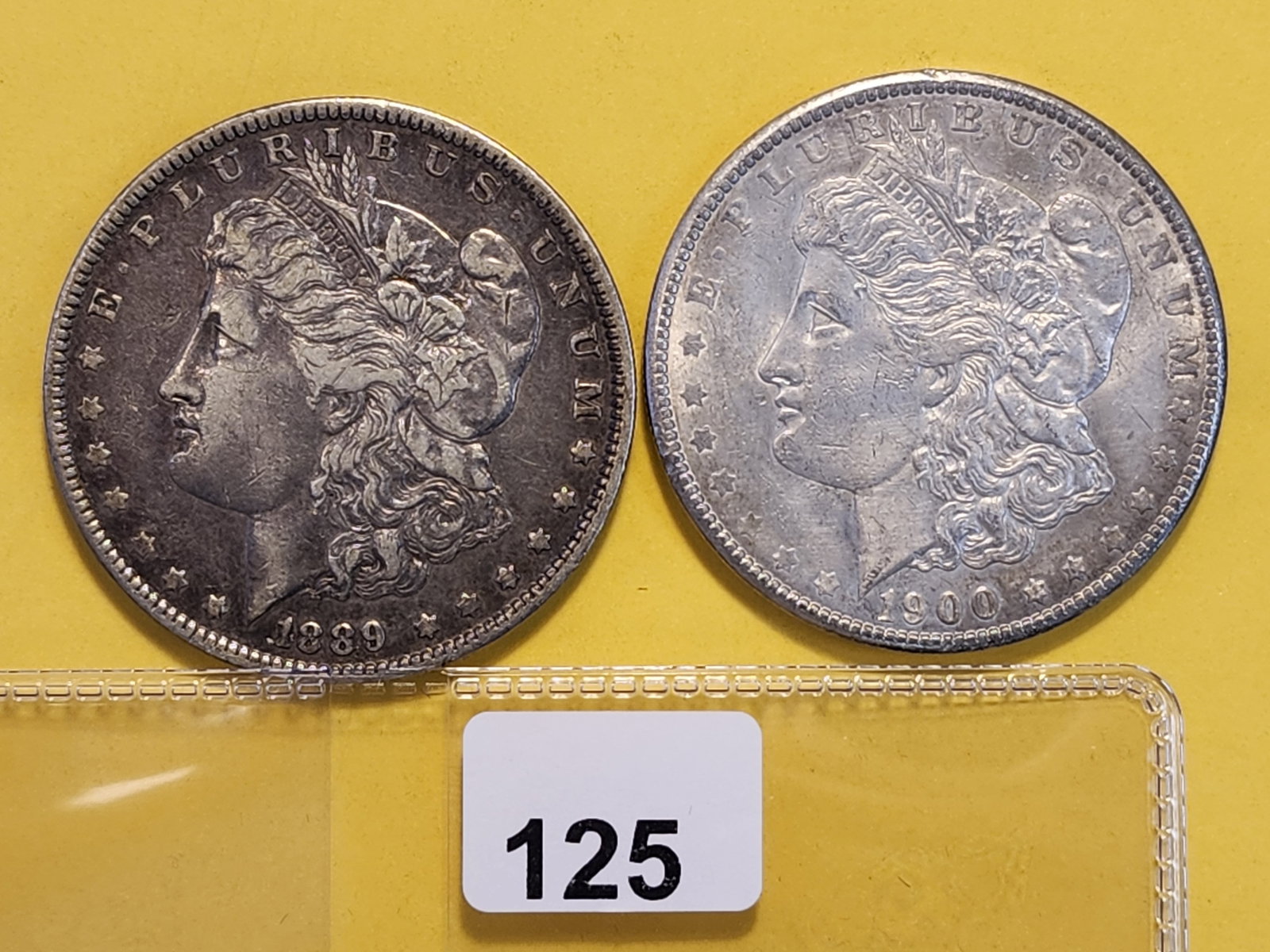 Two About Uncirculated Morgan Silver Dollars: 1889-O and 1900