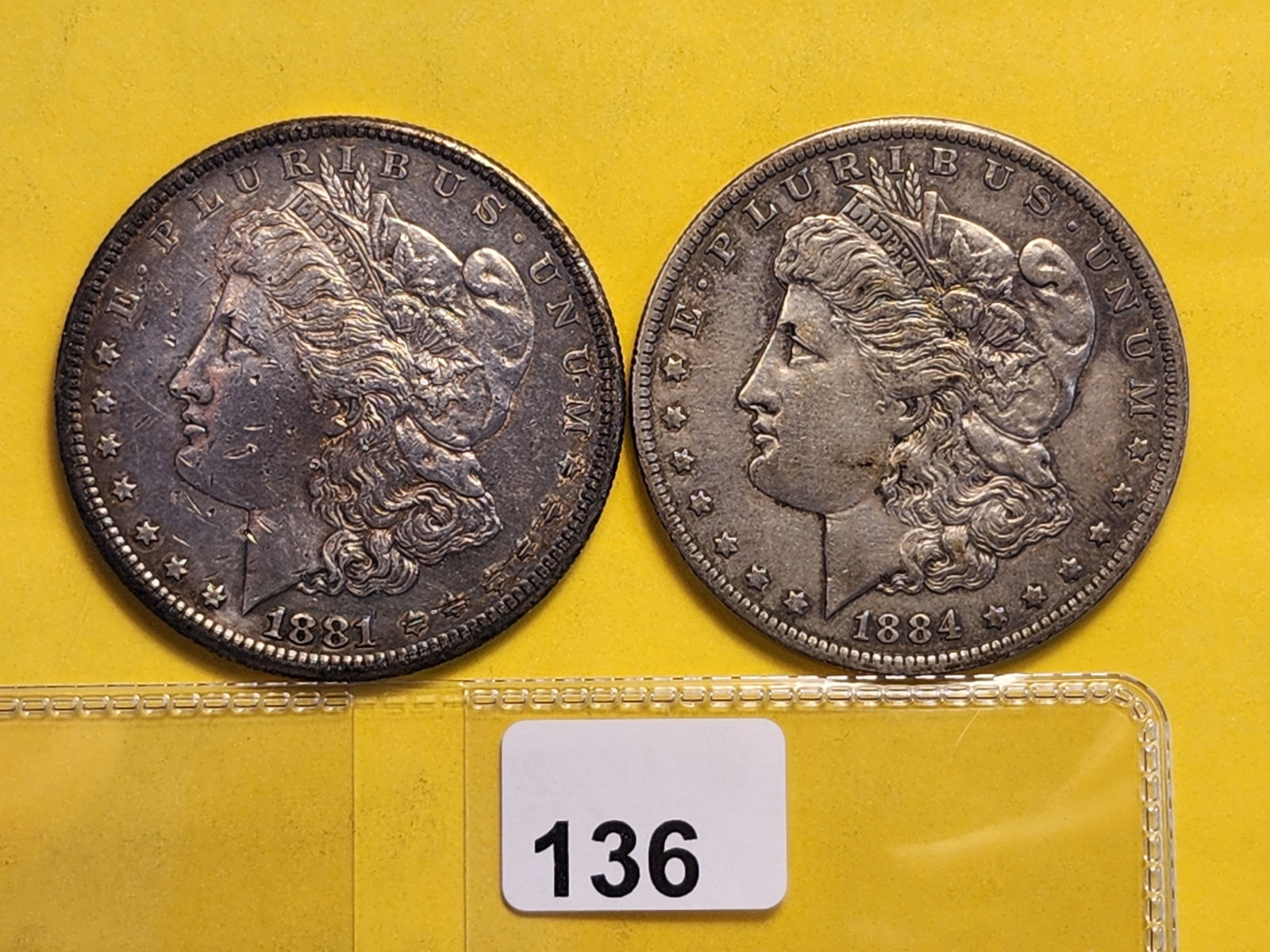 Two About Uncirculated Morgan Silver Dollars: 1881-S and 1884-O