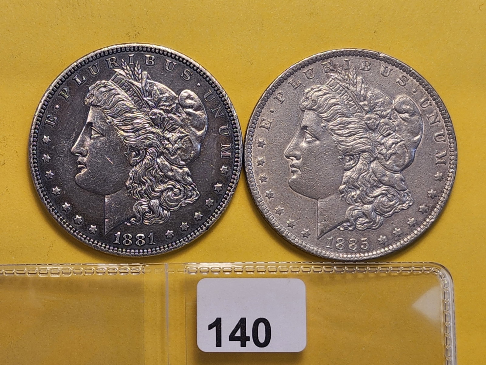 Two About Uncirculated Plus Morgan Silver Dollars: 1881 and 1885-O