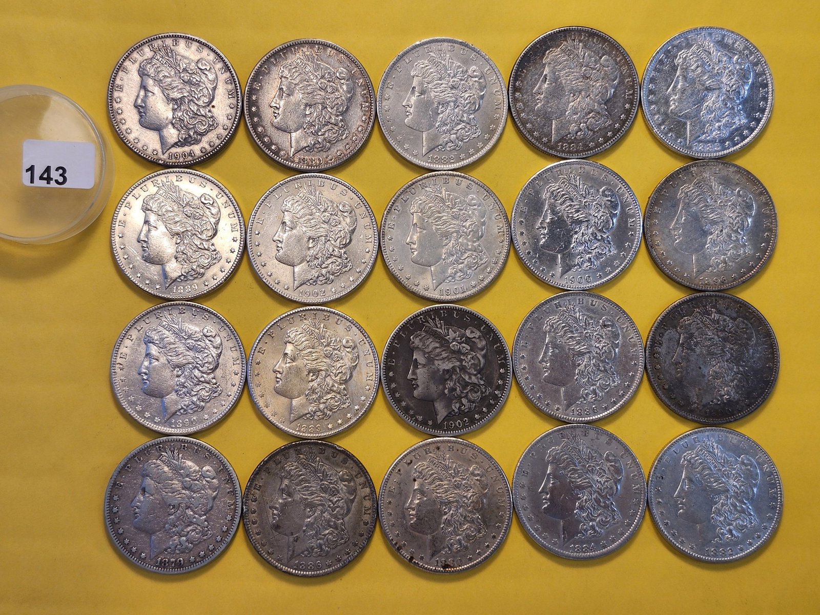 **FULL ROLL** Twenty Morgan Silver Dollars: Grades from Very Fine through Brilliant About Uncirculated