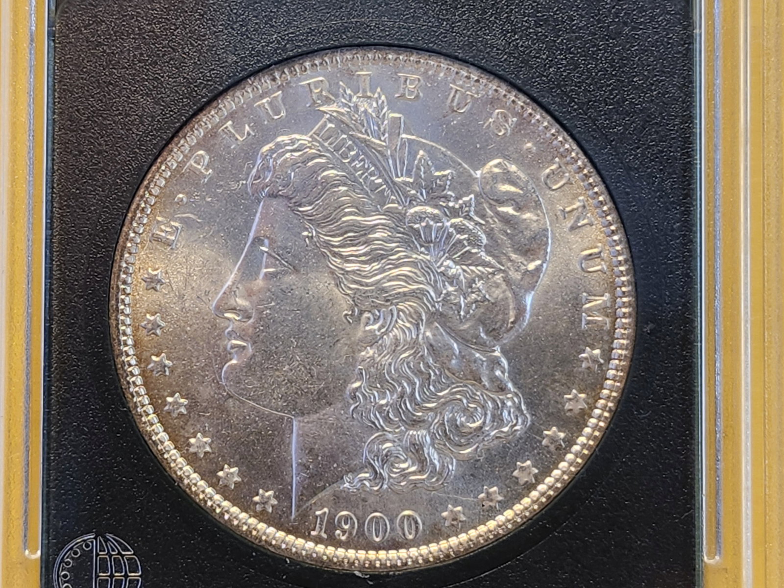 1900-O Morgan Silver Dollar: In Brilliant About Uncirculated