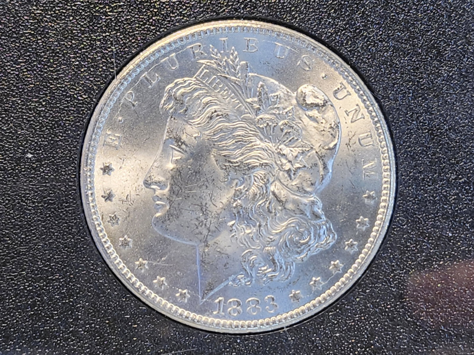 KEY DATE! 1883-CC Morgan Silver Dollar in Brilliant Uncirculated (1 of 4)