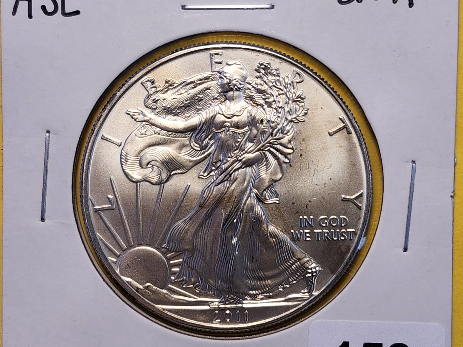 GEM Brilliant Uncirculated 2011 American Silver Eagle: Lightly toned
