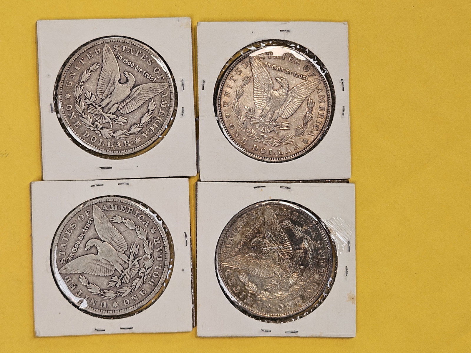 Four mixed Morgan Silver Dollars - 2