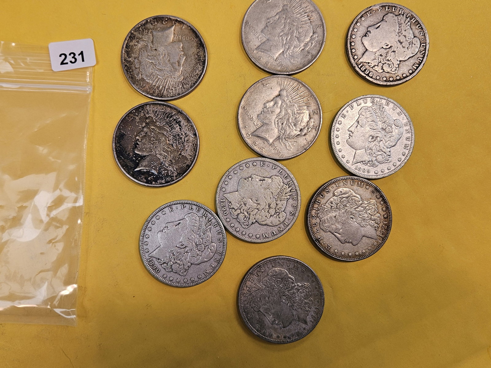 Ten mixed silver dollars: Morgan and Peace