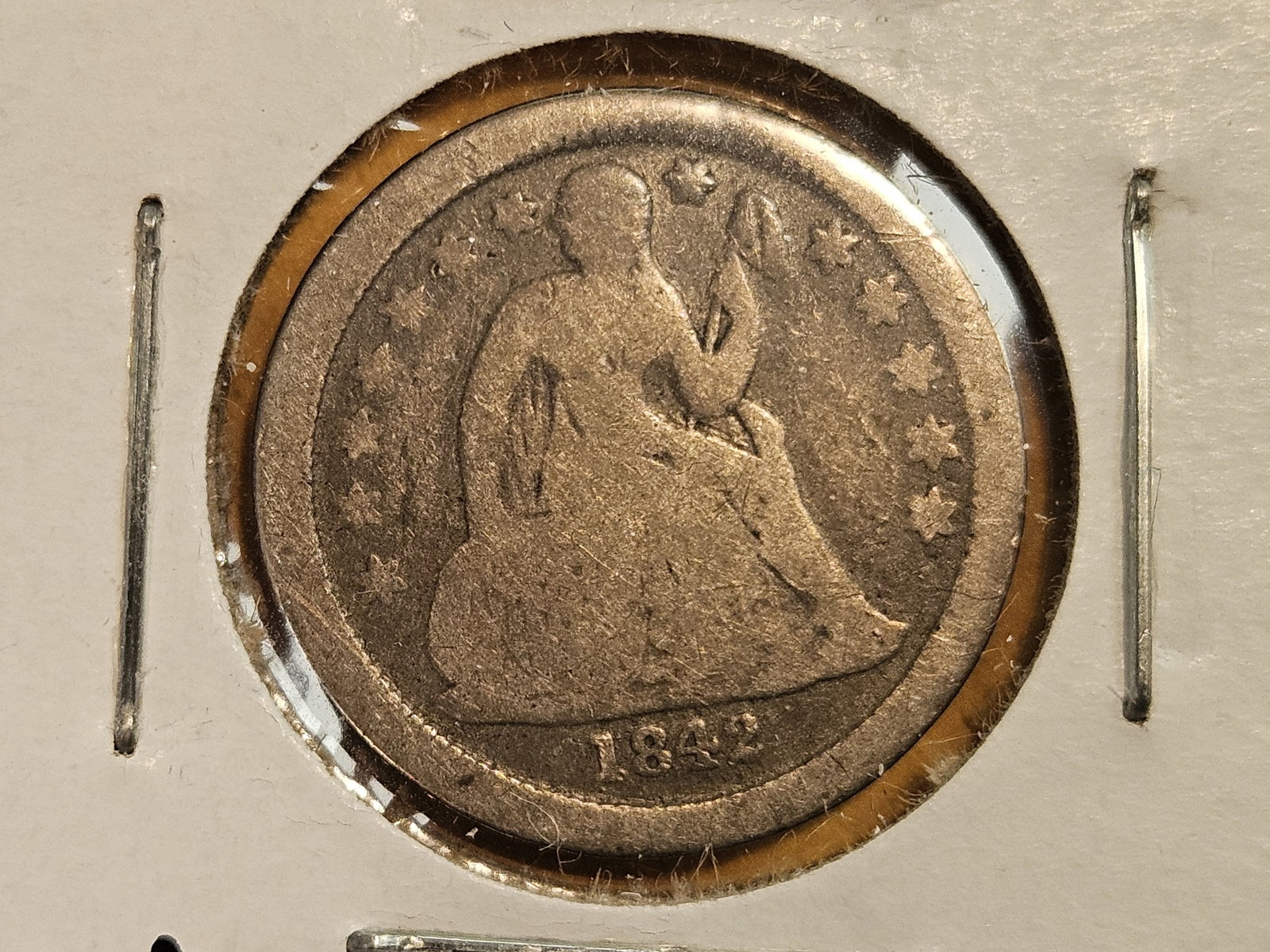 Better date 1842-O Seated Liberty silver dime: Full rims obverse