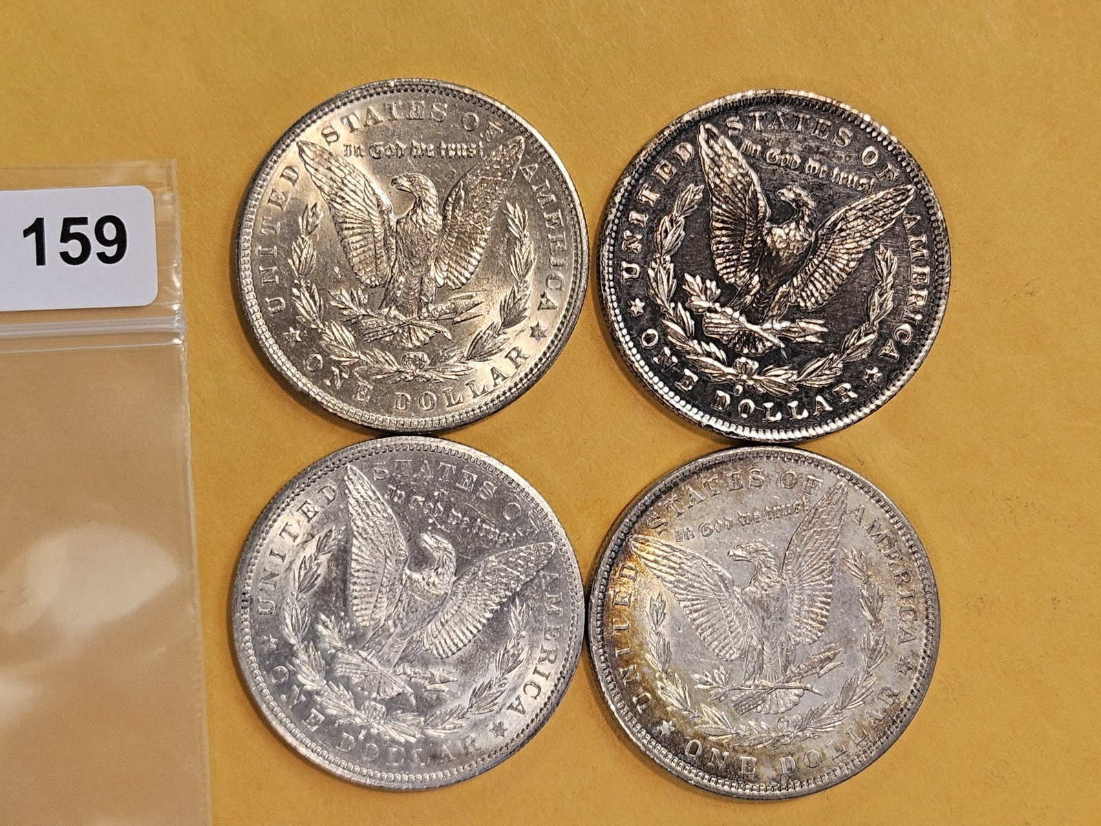 Four mixed Morgan silver Dollars - 3