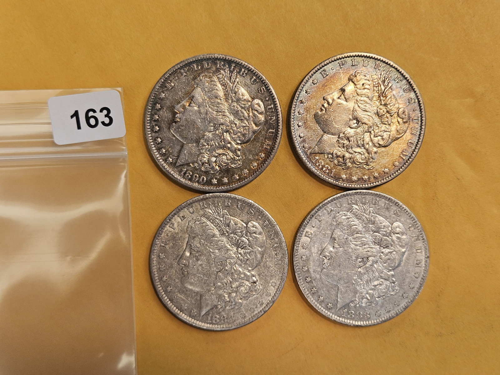 Four mixed Morgan silver Dollars (1 of 3)