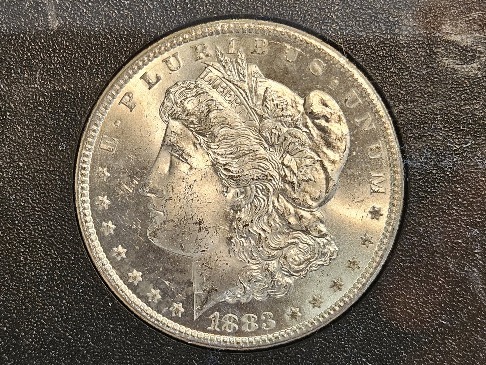 ** KEY DATE ** GSA 1883-CC Morgan Dollar in Very Choice Brilliant Uncirculated: KEY DATE! CARSON CITY! In original GSA Hard pack. No outer box or COA. Starting to get a beautiful rainbow tone on the reverse