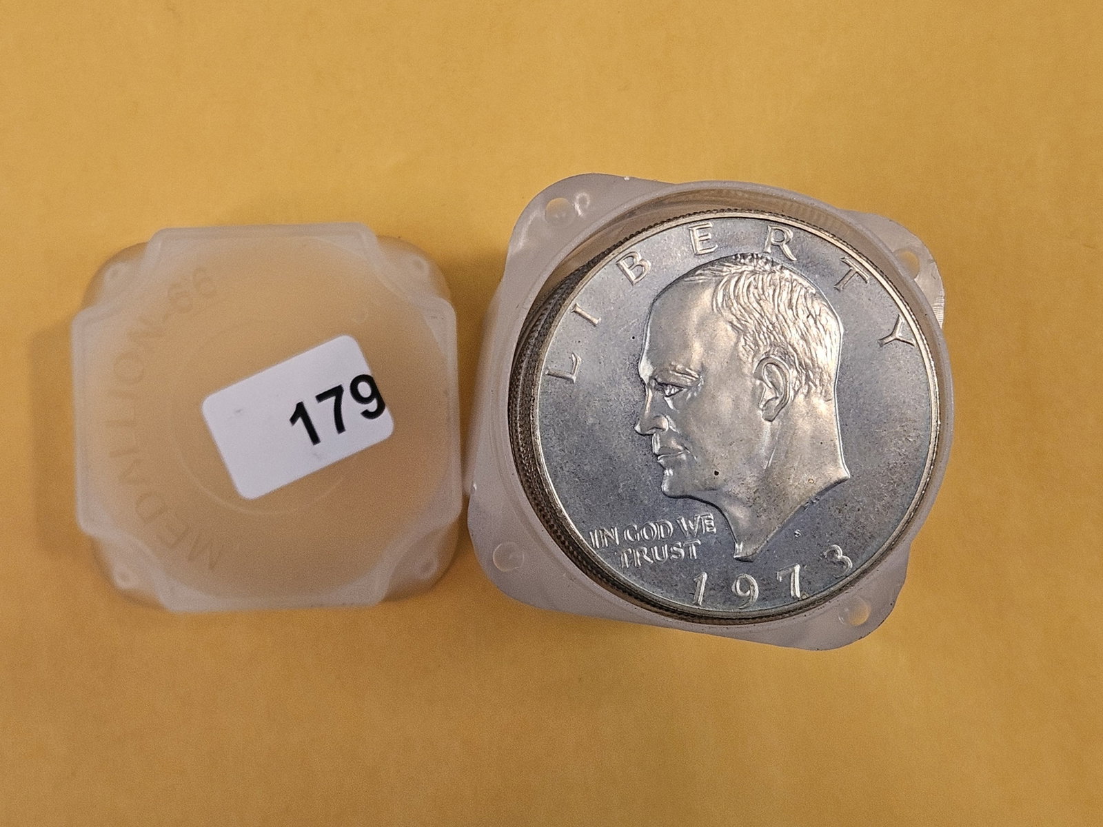 Full roll of Eisenhower Dollars: Mixed. Unchecked by us. The top one is silver, rest look clad from the sides