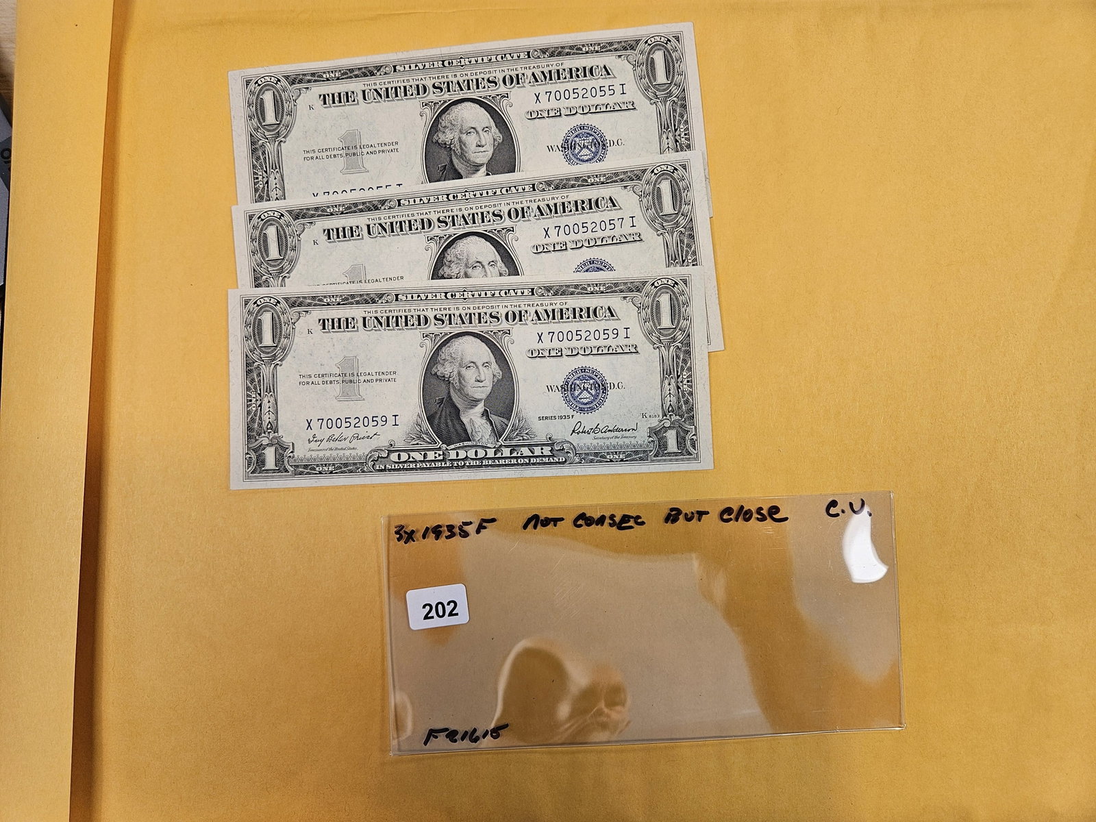 * Three Crisp Uncirculated One Dollar Silver Certificates: All 1935-F. Not quite consecutive, but close