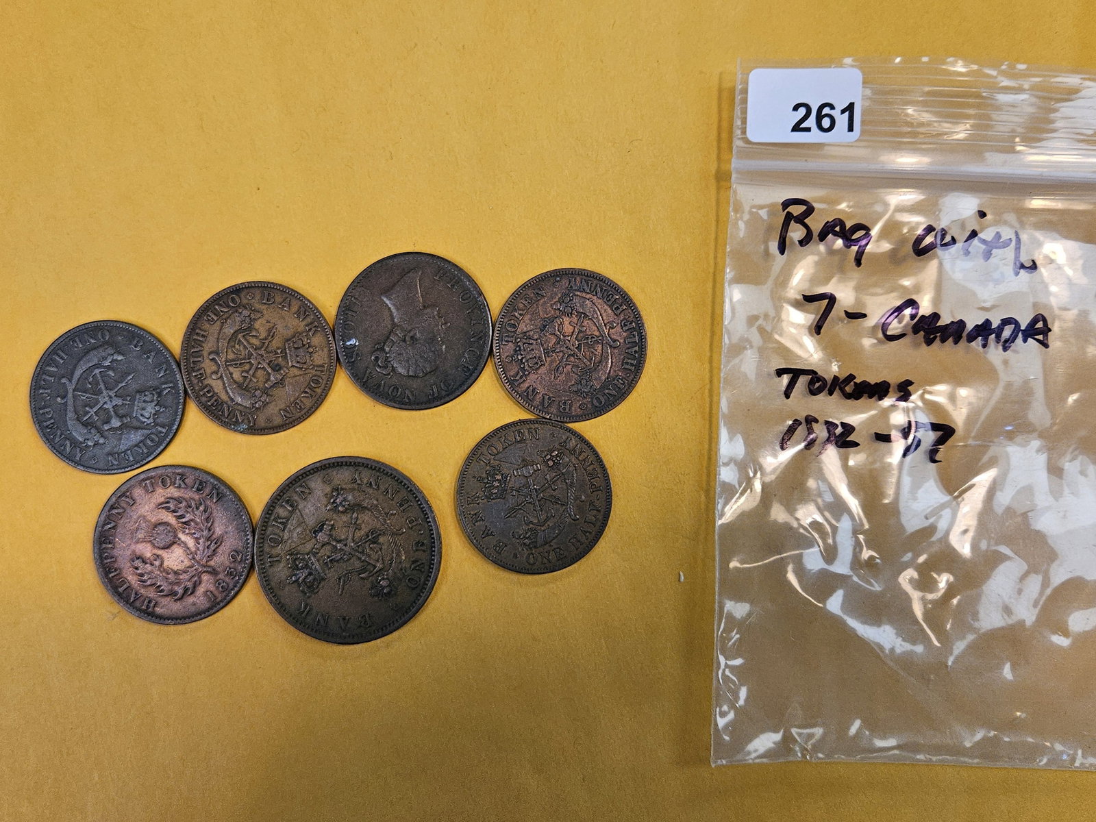 Bag with Seven mixed Canadian Copper Tokens: Early to mid-1800s. One penny and one-half penny