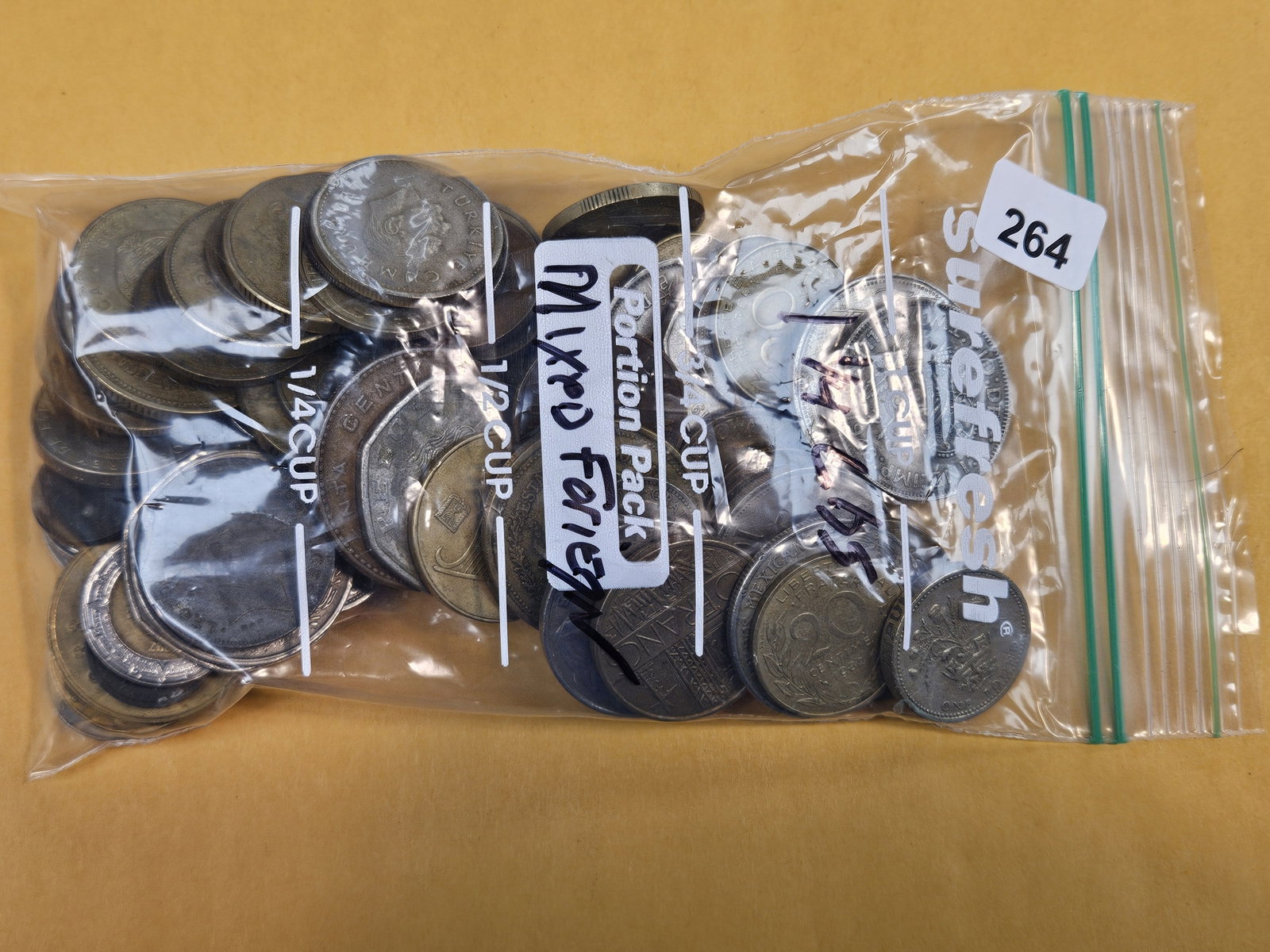 One and one-quarter Pounds of mixed World coins: From dealer. Unchecked by us