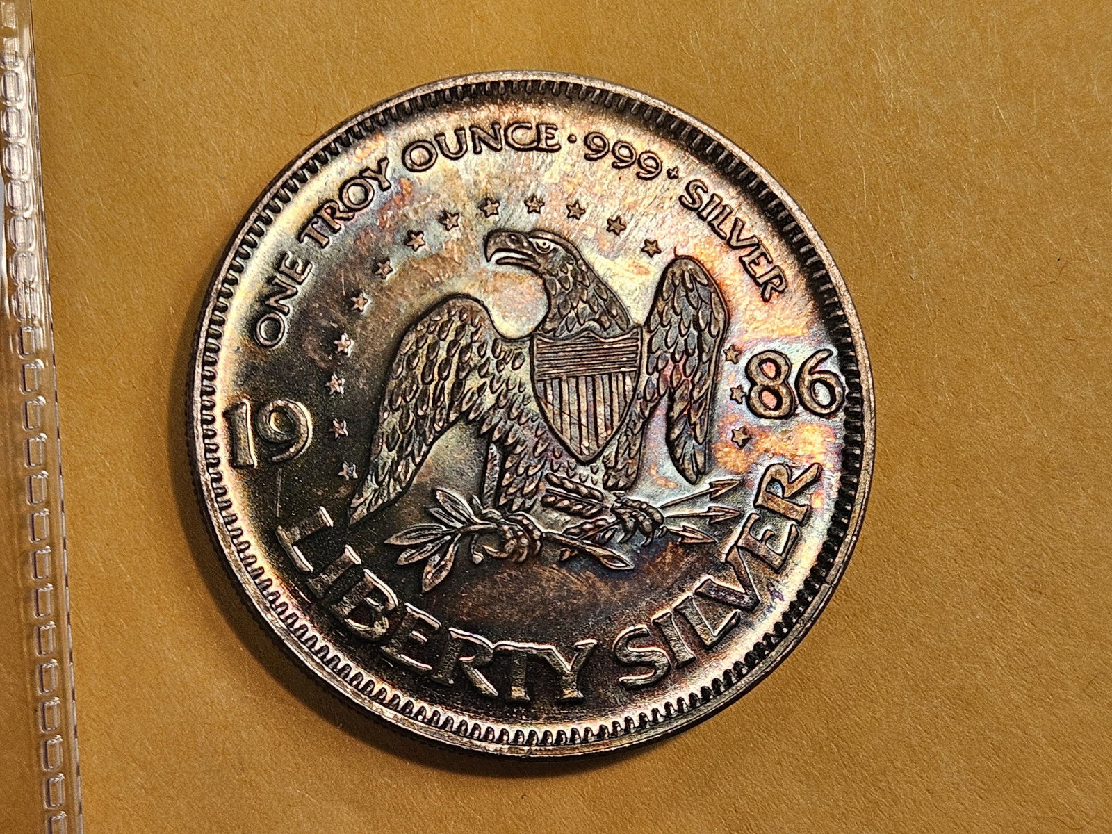 One Troy ounce .999 fine silver art round: Has some phenomenal toning!