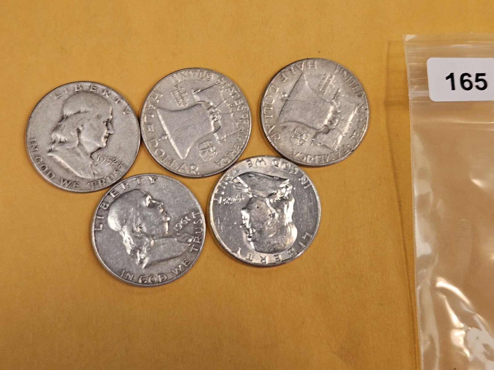 Five mixed silver Franklin Half Dollars (1 of 1)