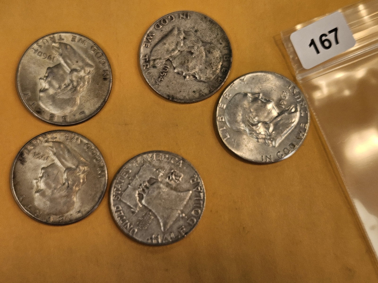 Five mixed silver Franklin Half Dollars: Circulated