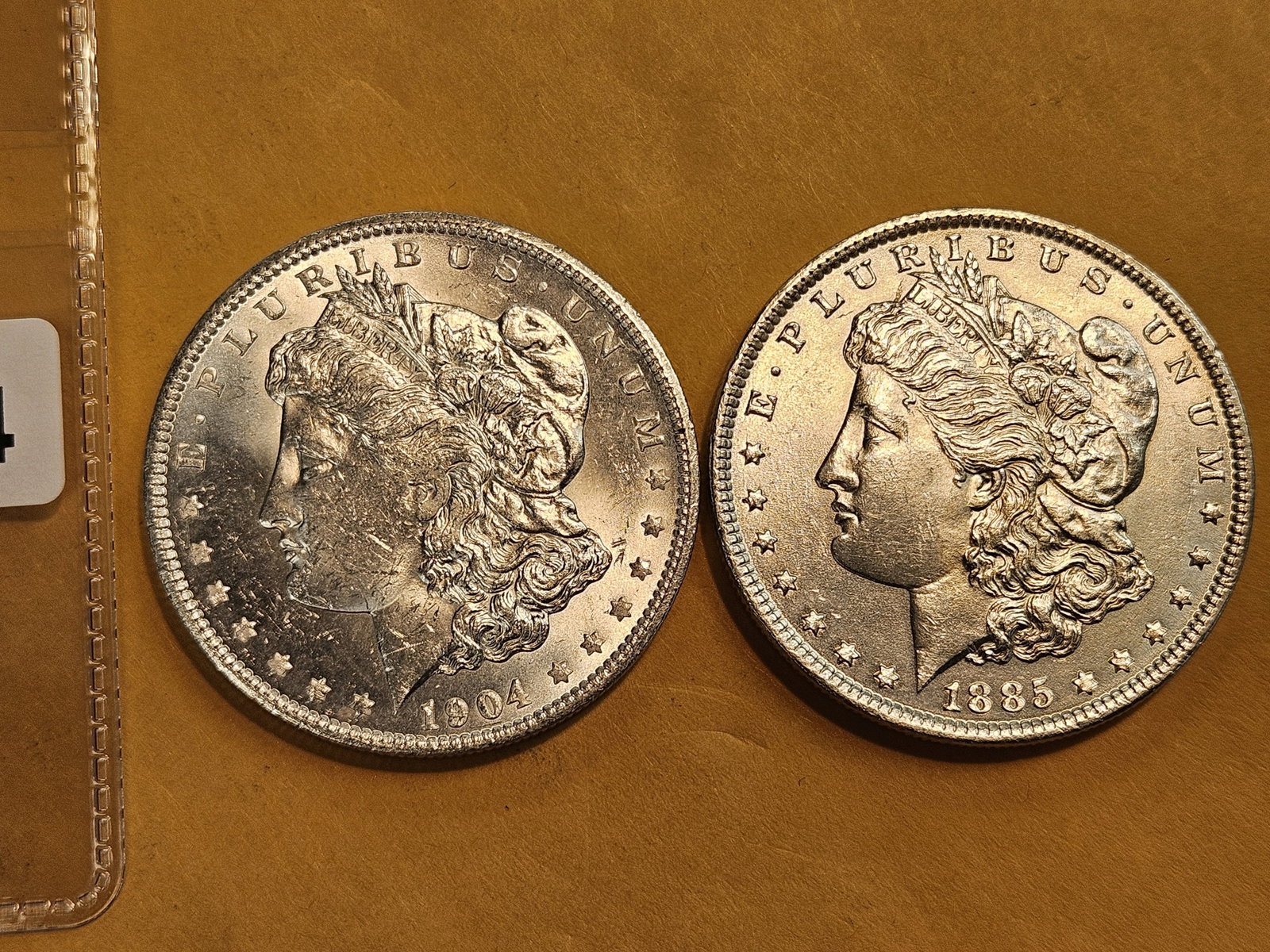 Two Brilliant About Uncirculated Morgan silver Dollars: Mixed.