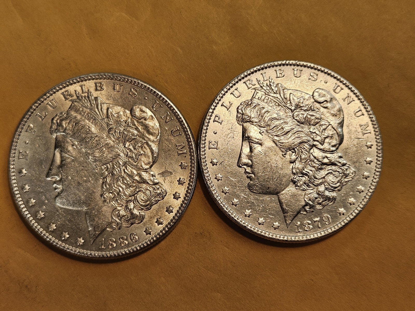 Two Brilliant About Uncirculated Morgan silver Dollars: Mixed.