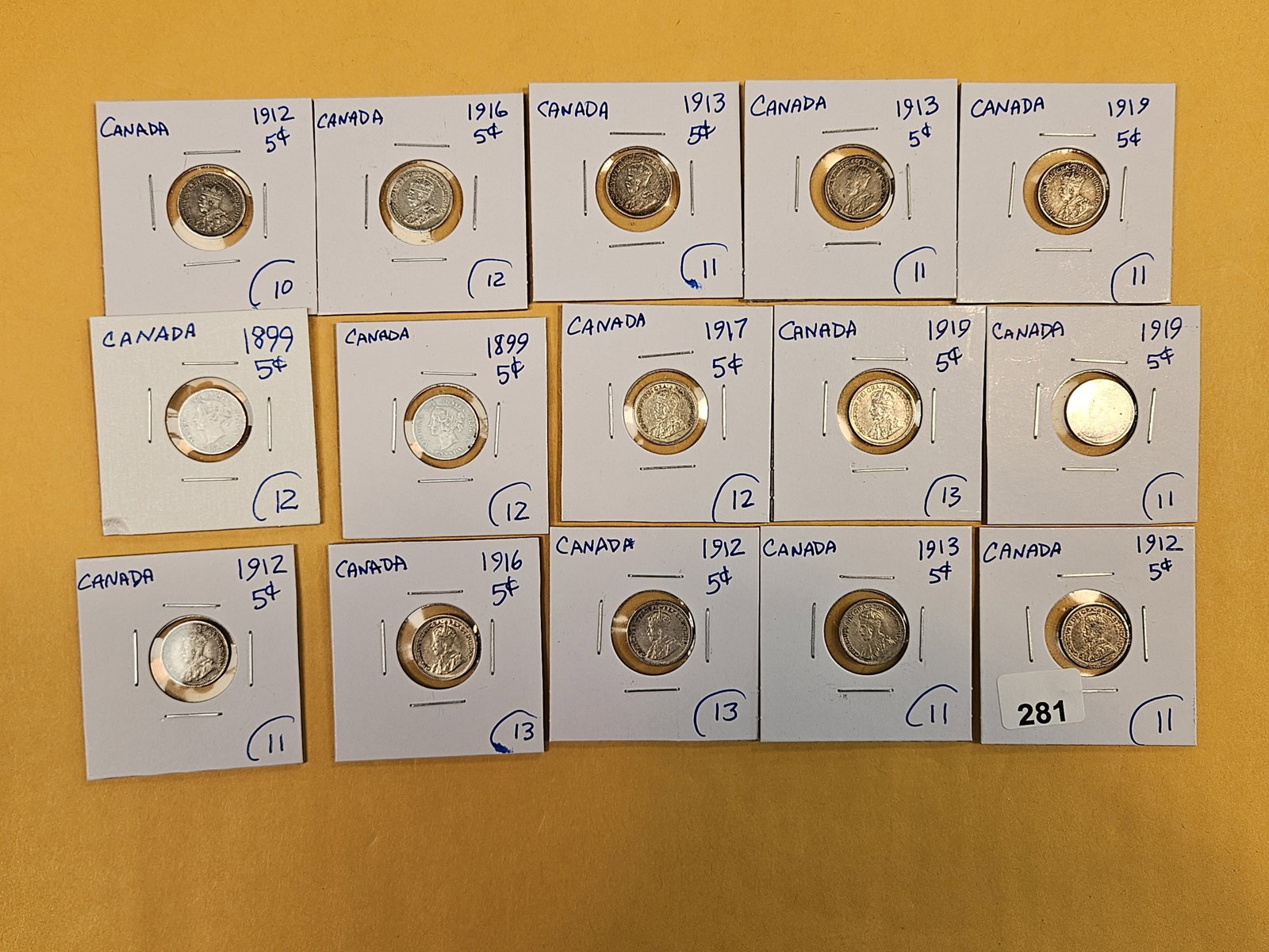 Fifteen mixed, silver, Canadian 5 cent coins: Mixed dates and grades.