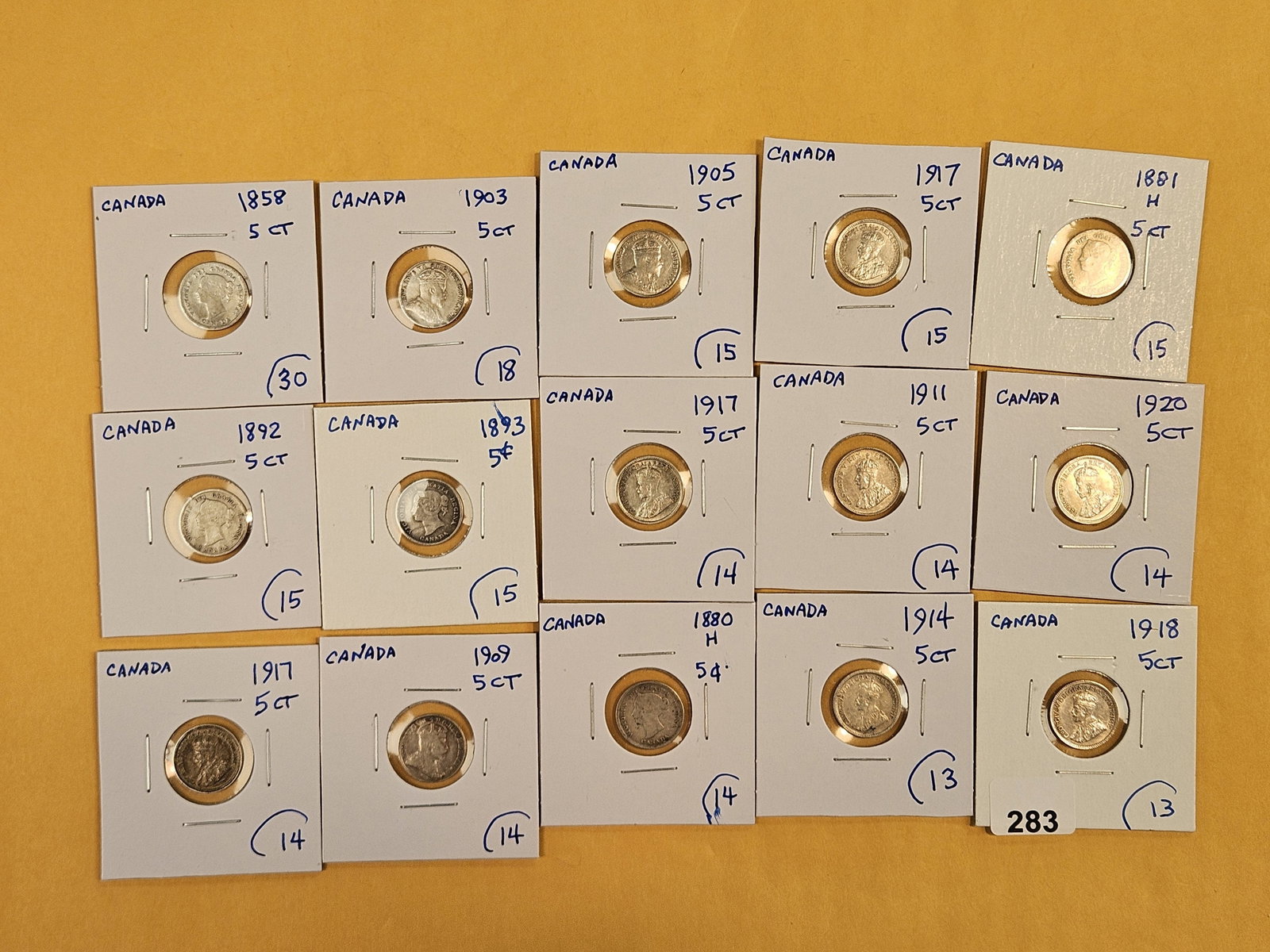 Fifteen mixed, silver, Canadian 5 cent coins: Mixed dates and grades.