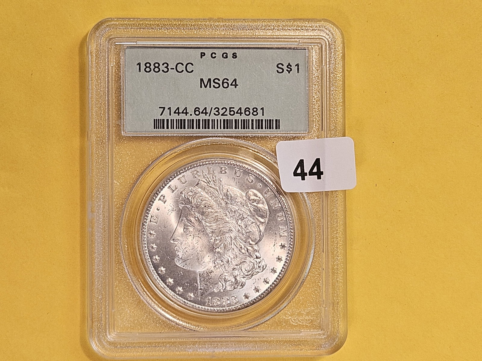 ** KEY DATE ** PCGS OGH 1883-CC Morgan Dollar in Mint State 64 - 2
