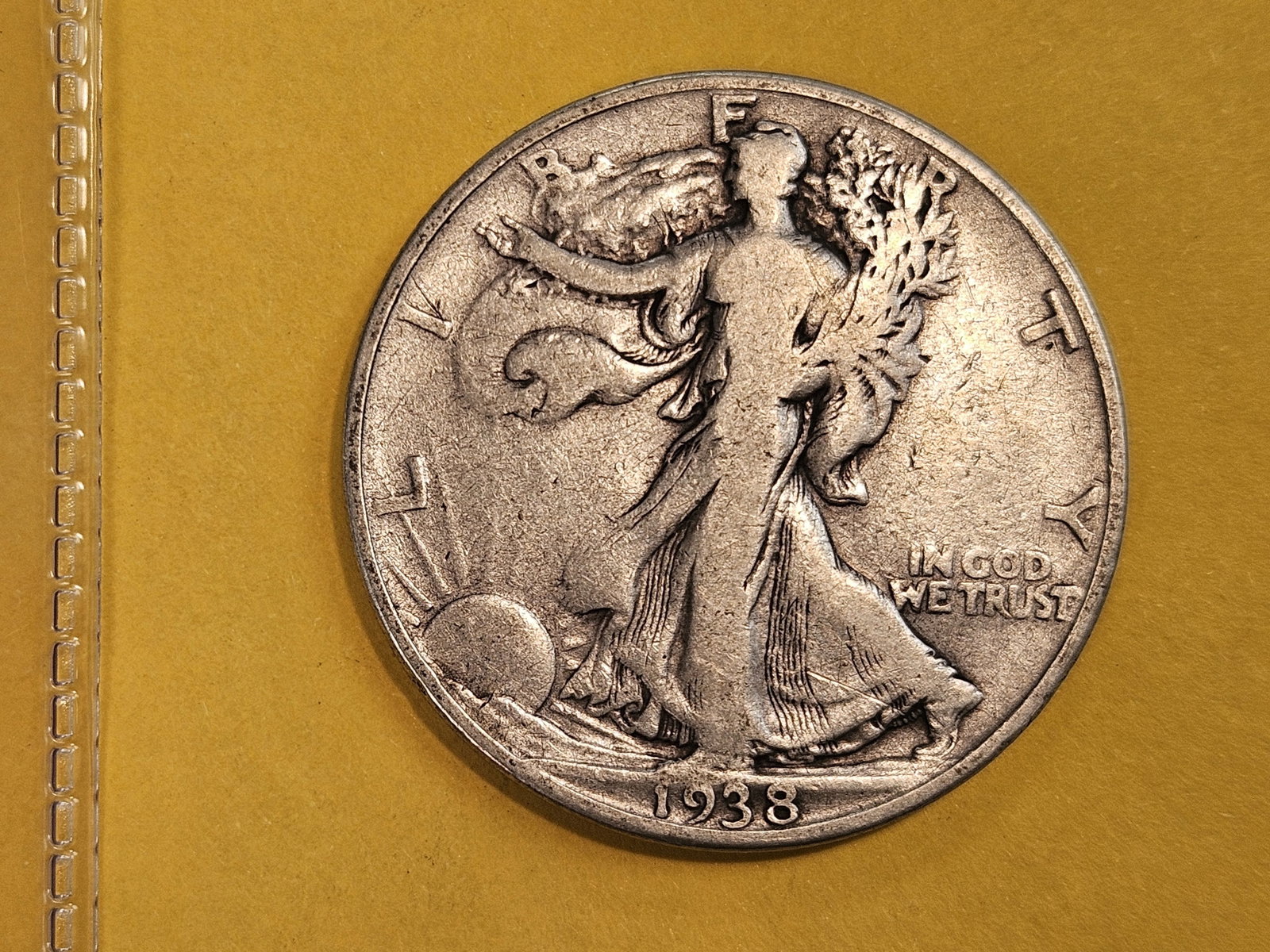 * KEY DATE 1938-D Walking Liberty Half Dollar: In Fine.