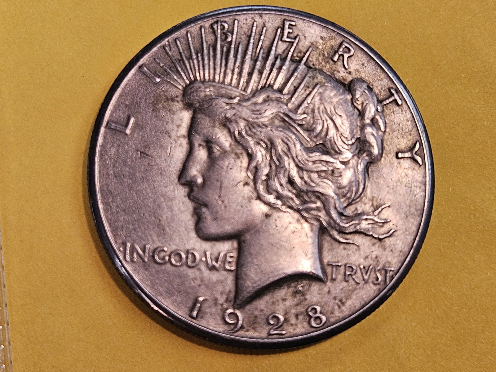 ** KEY DATE ** 1928 Peace Silver Dollar in Extra Fine: Toned
