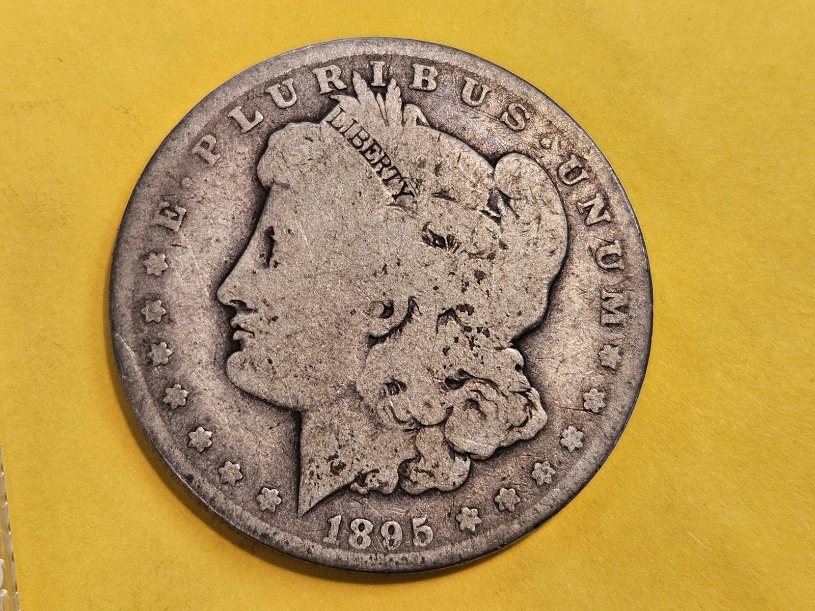 ** KEY DATE ** 1895-O Morgan Dollar in Good plus: Nice, even wear
