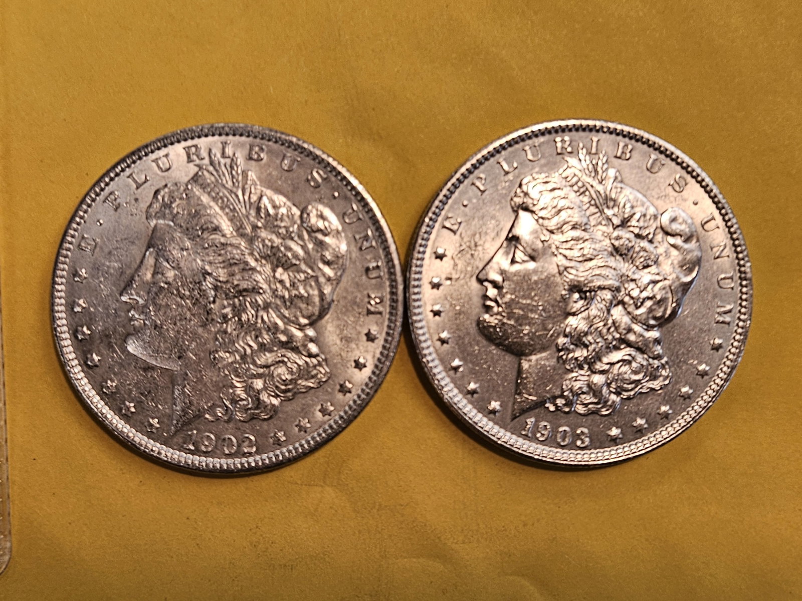 Two Brilliant About Uncirculated Plus Morgan Dollars: Mixed