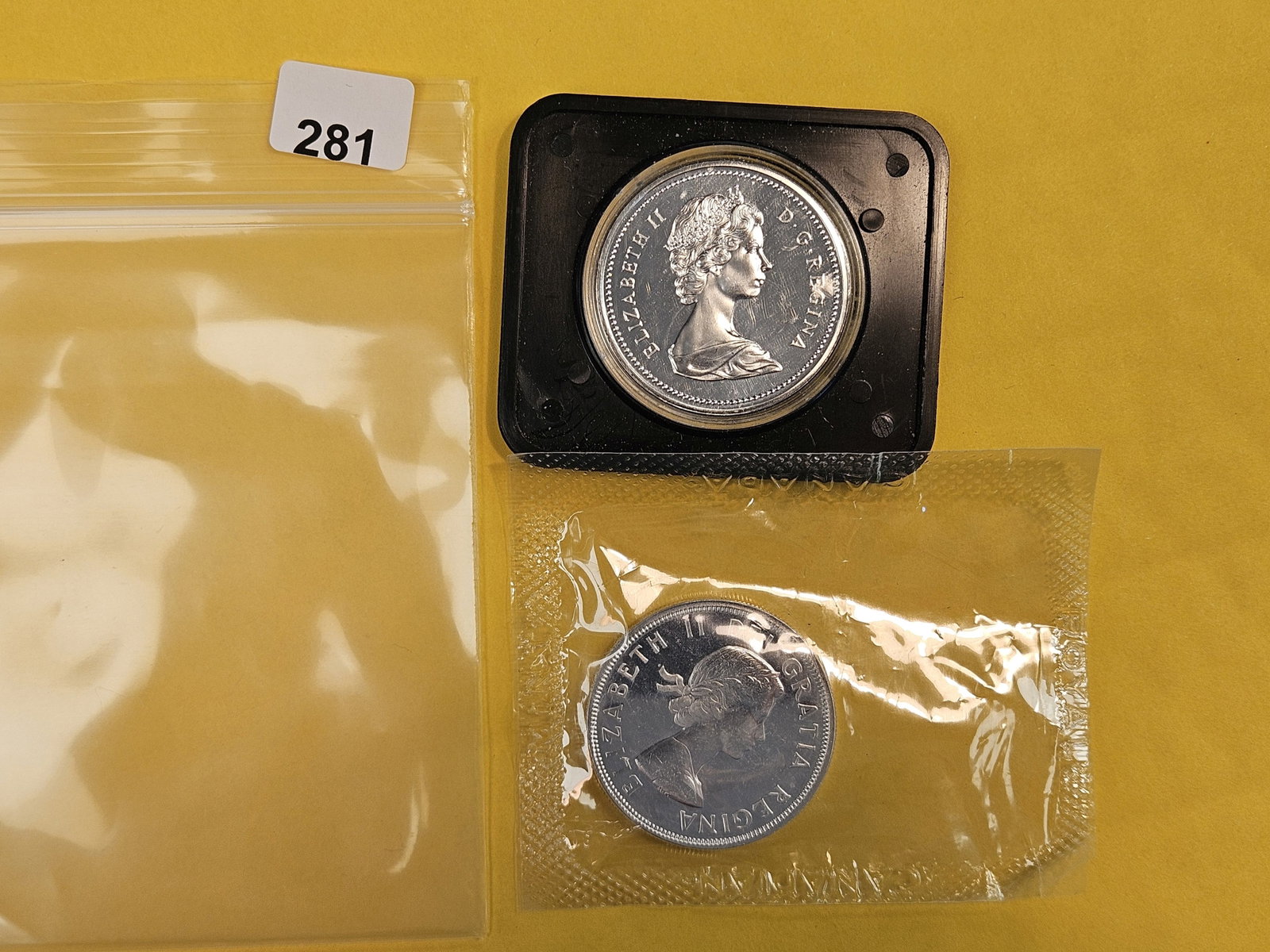 Two GEM Canada Silver Dollars (1 of 2)