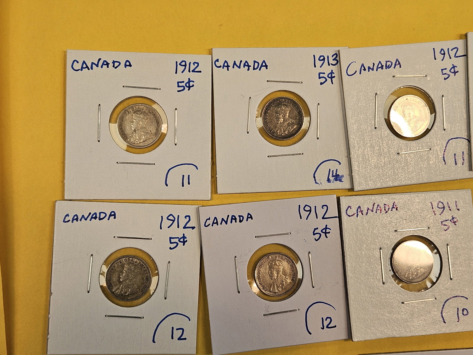 Eighteen, silver, Canadian 5 cent coins - 2