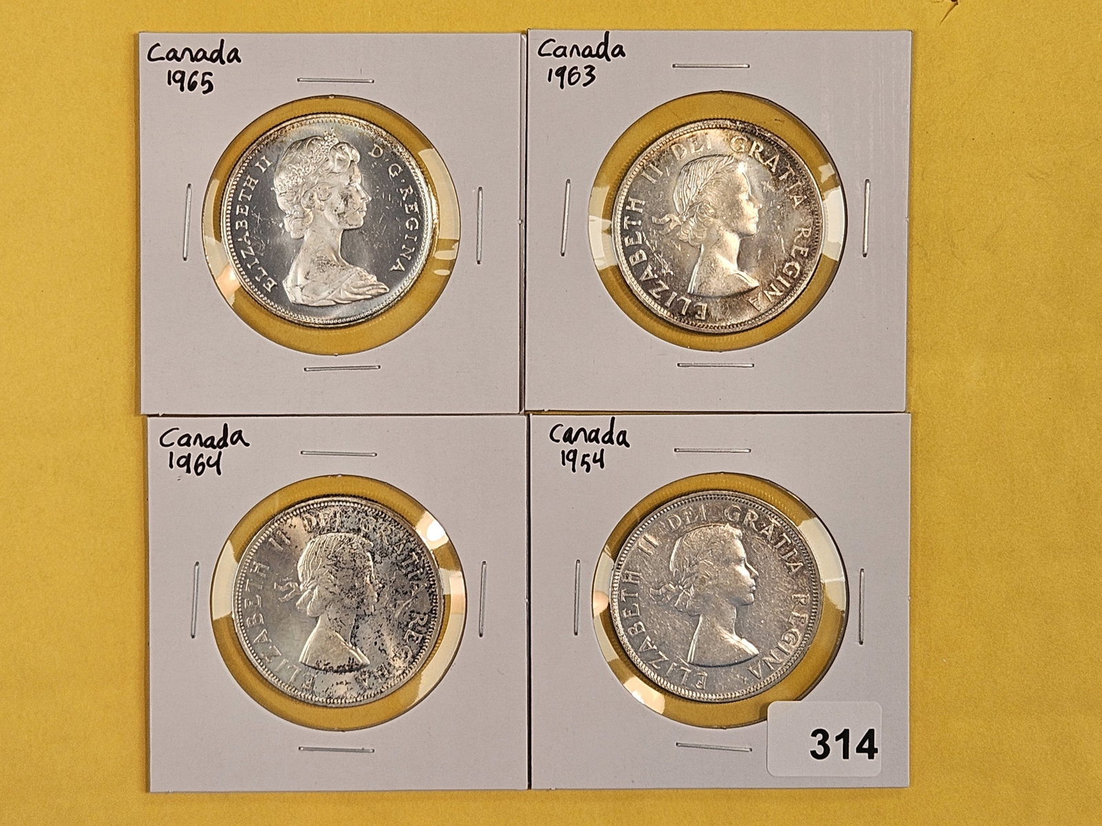 Four Mixed Canadian Silver Dollars (1 of 3)