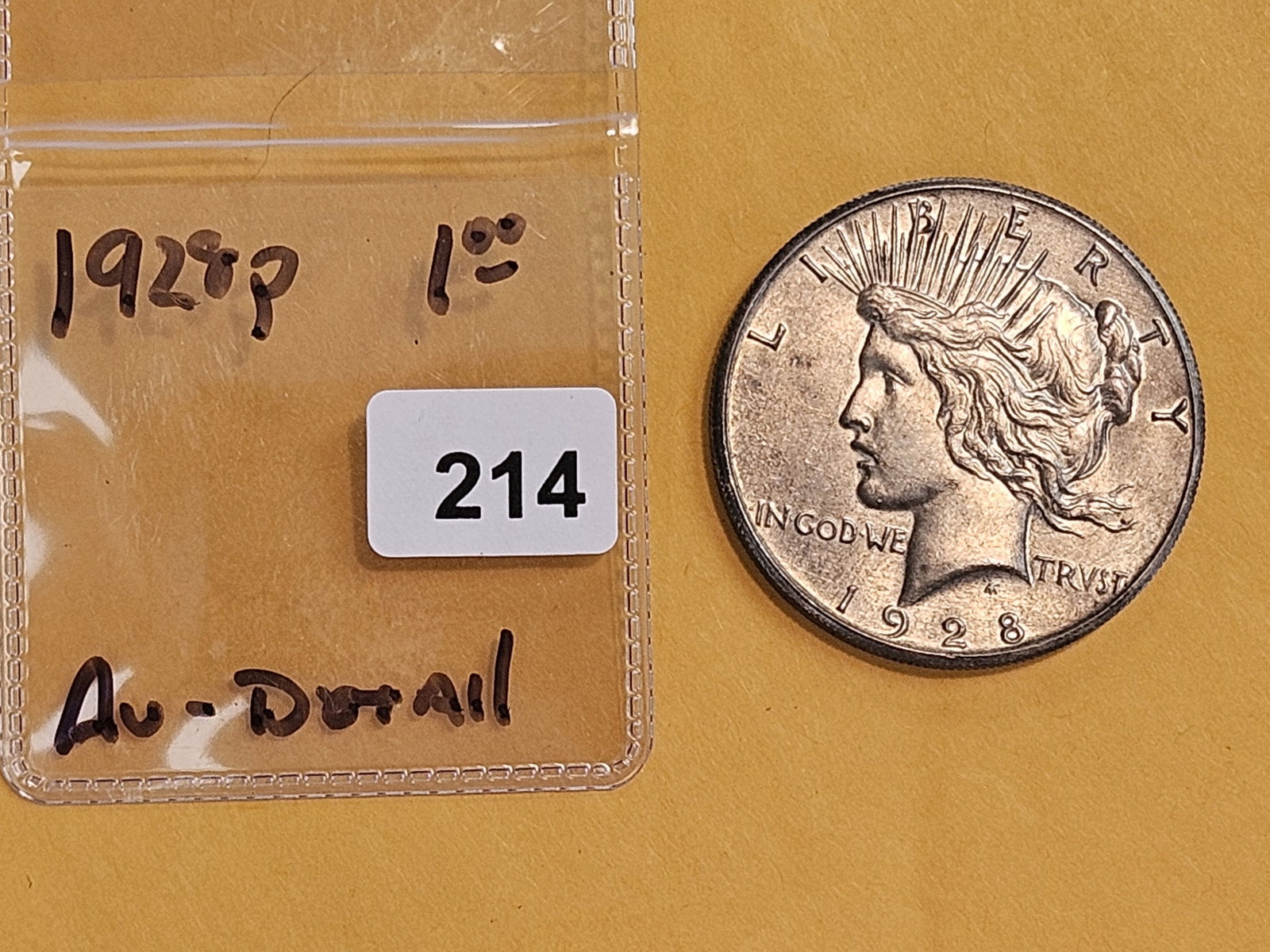 ** KEY DATE ** 1928 Peace Silver Dollar in About Uncirculated - details - 2