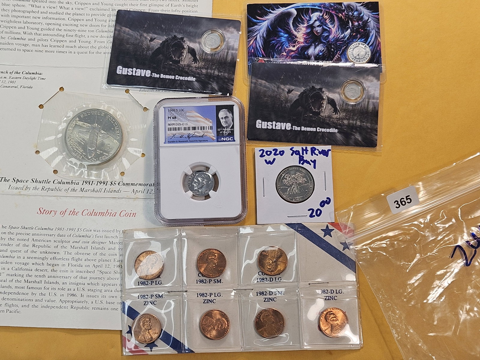 HODGEPODGE LOT WITH PLATINUM AND SILVER!: Two 1/1000 Troy Ounce Platinum Rounds, a 1 Gram Silver round, NGC Graded Roosevelt Dime, 2020 West Point Quarter, 1982 7-Coin Lincoln Cent set and a Marshall Islands Commemorative $5