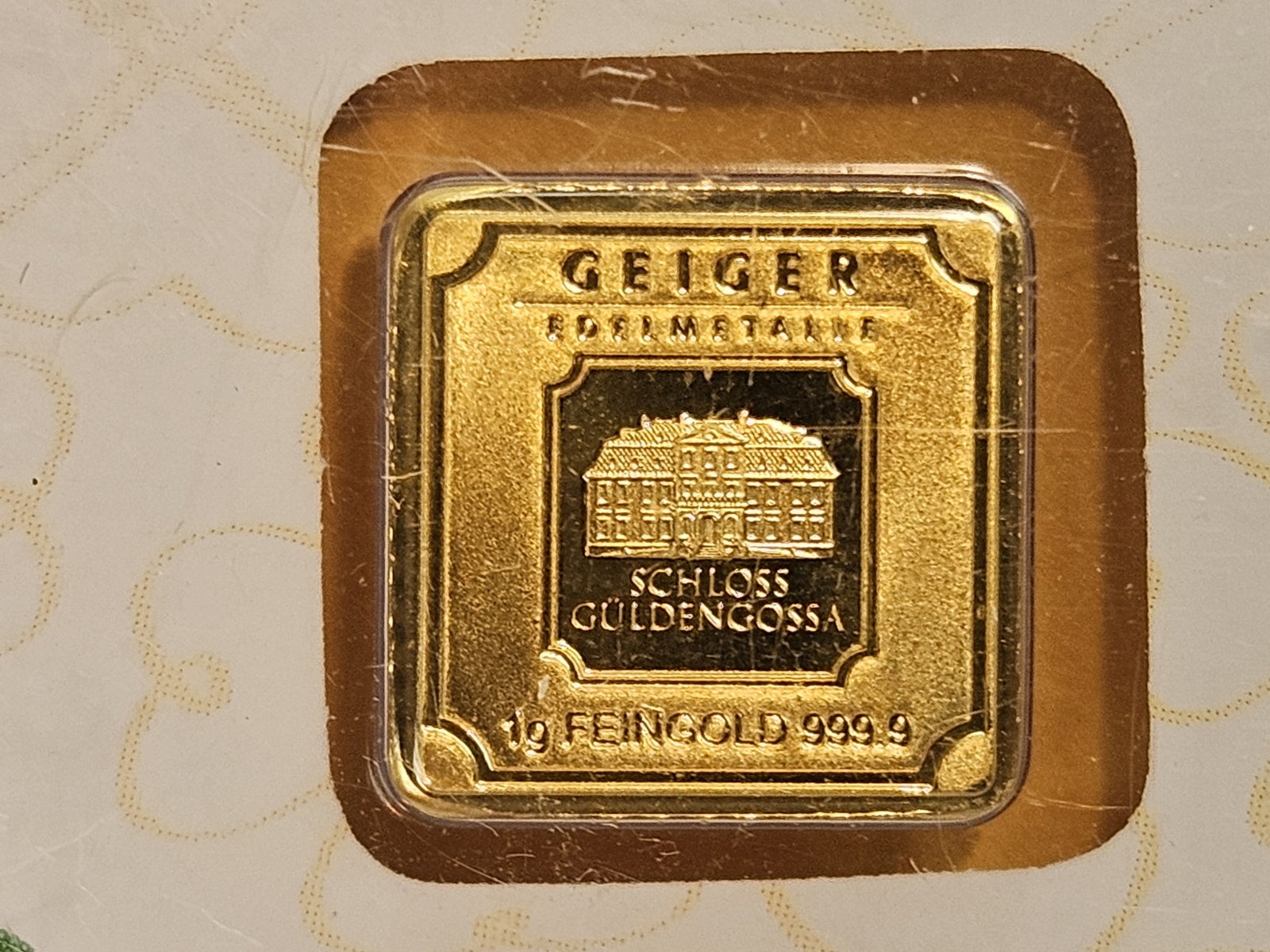 GOLD! GEM One Gram .9999 fine gold bar: Geiger Original. In assay holder