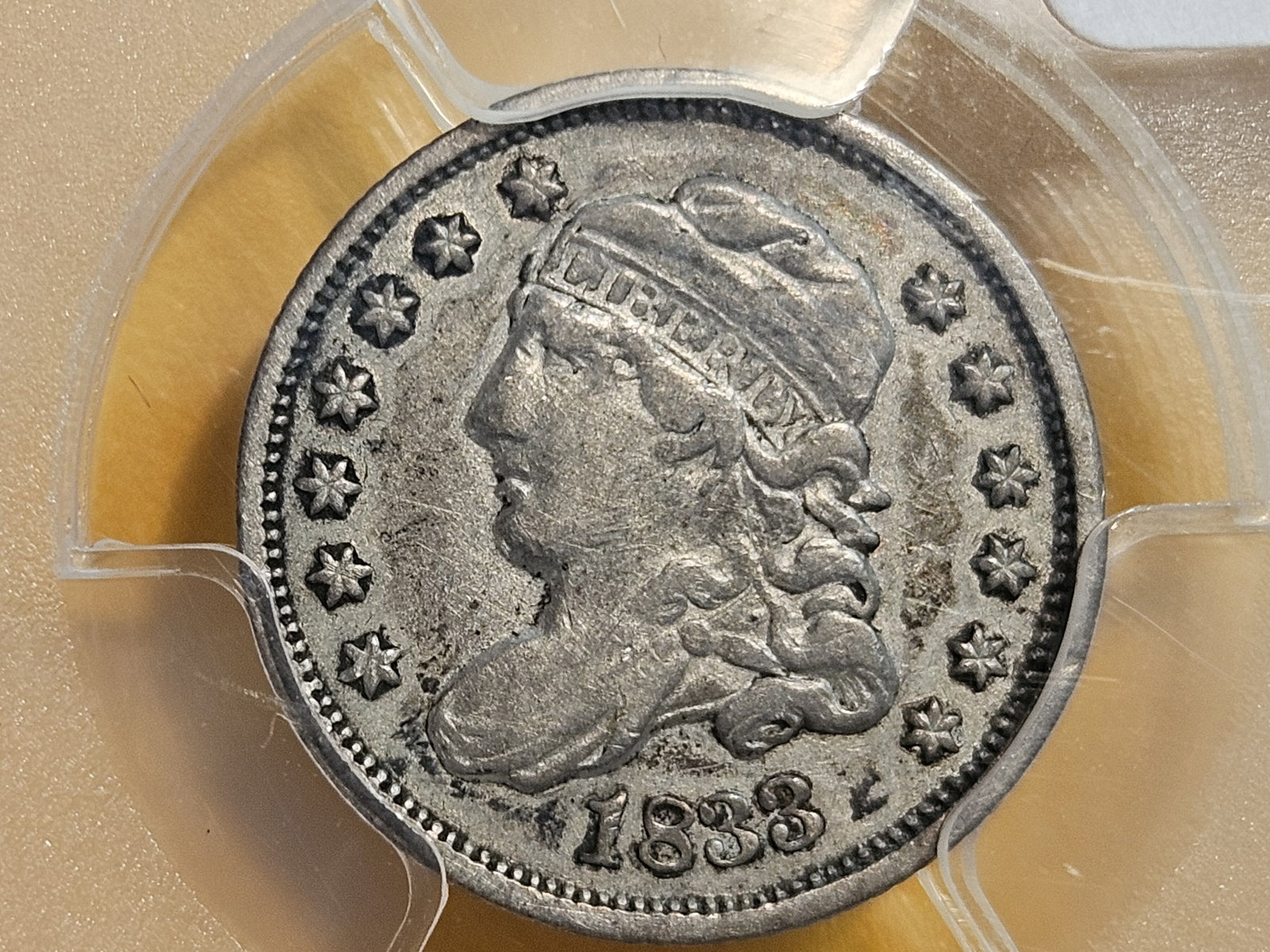 PCGS 1833 Capped Bust Half-Dime in Very Fine - 30: Holdered in a PCGS 40th Anniversary slab reminiscent of an Old Green Holder