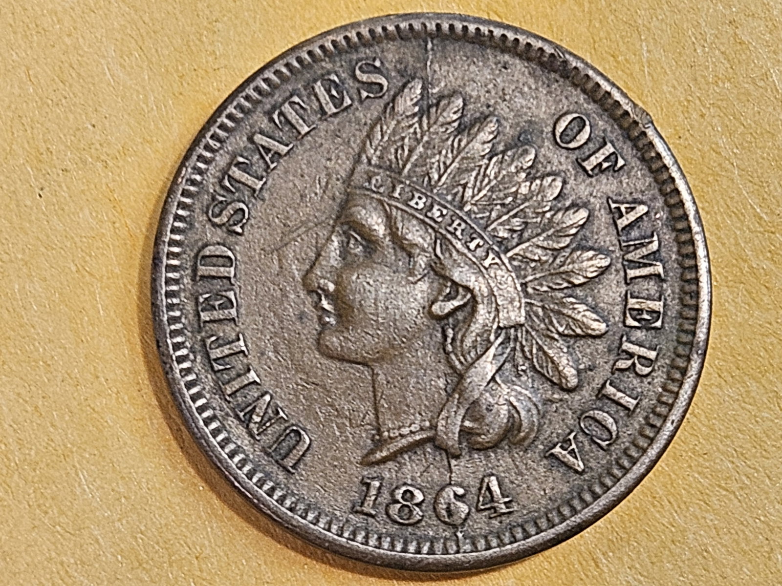 VARIETY! 1864-L Indian Cent in About Uncirculated plus: "Snow-16. NGC: 1864 L BRONZE BISECTING CRACK VP-012. NGC Attribution: BISECTING CRACK VP-012. Cross Reference: Snow: S-16