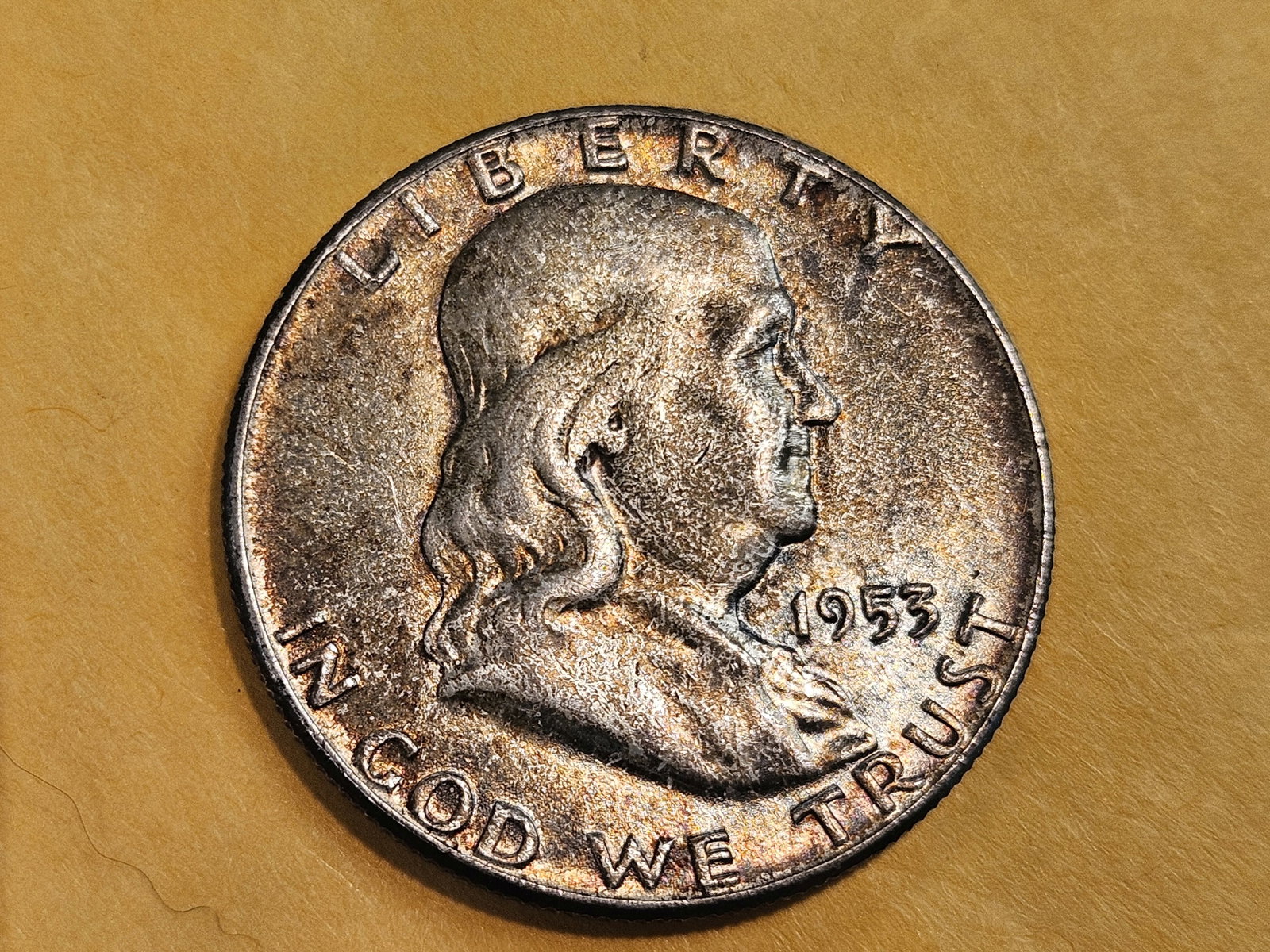 GEM Brilliant Uncirculated Toned 1953 Franklin Half Dollar: Straight from a mint set. Cool toning
